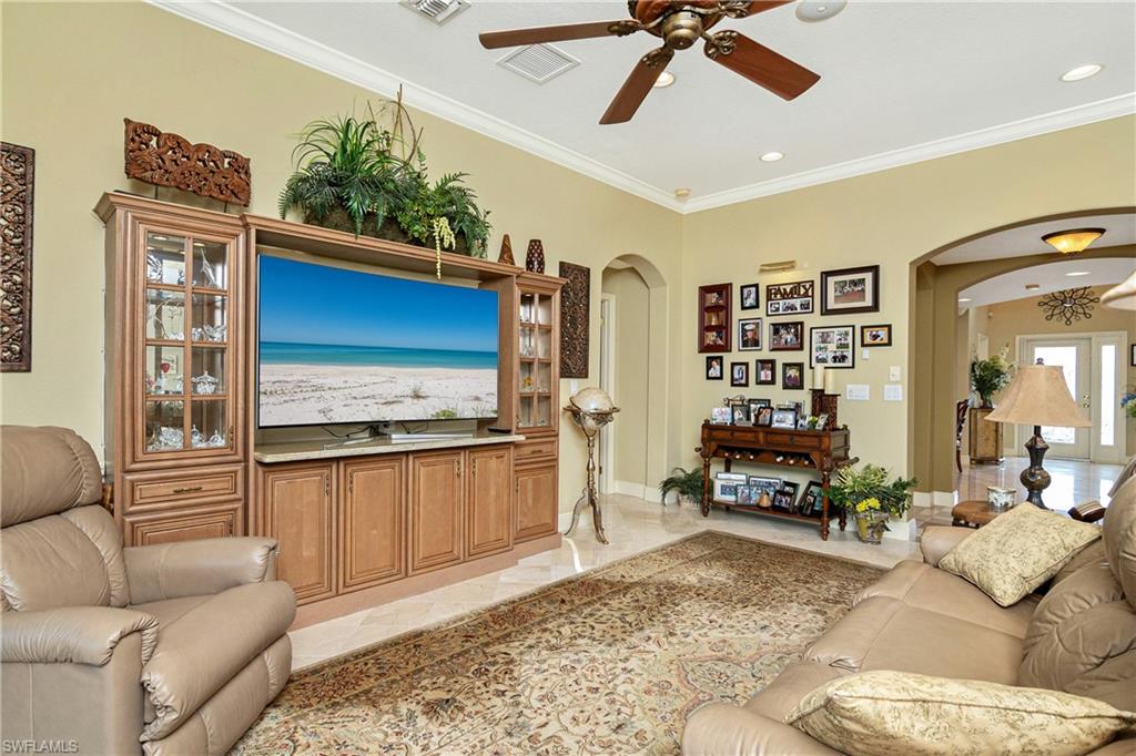 19733 Villa Rosa Loop Estero, FL 33967 - Photo 15 of 35 a living room with furniture and a flat screen tv