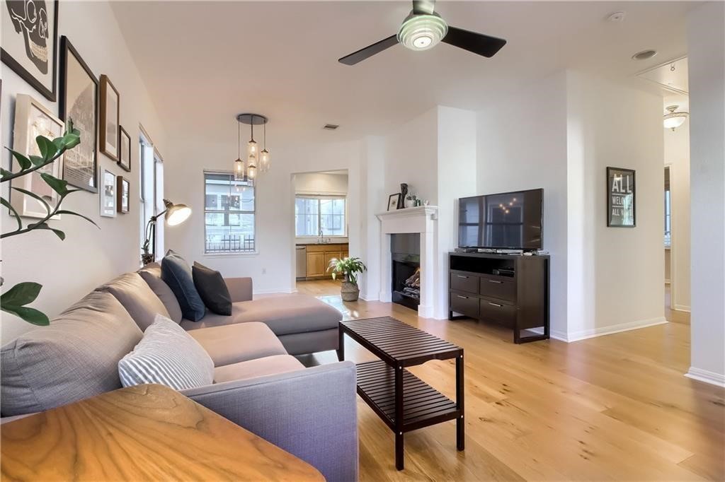 1011 Brodie Street, Unit 32 Austin, TX 78704 - Photo 1 of 1 a living room with furniture and a flat screen tv