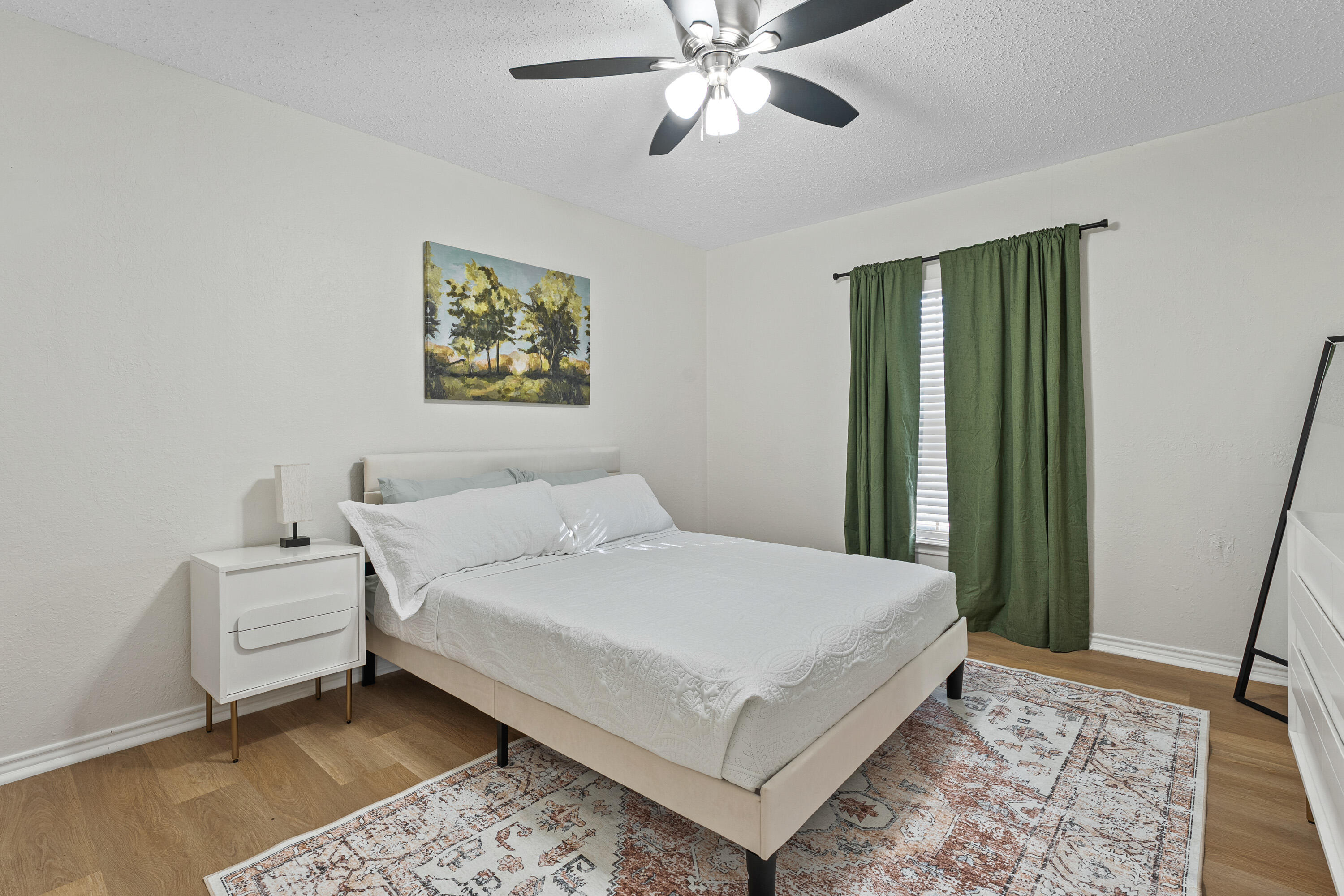 4510 77th Street Lubbock, TX 79424 - Photo 16 of 26 a large white bed in a white room