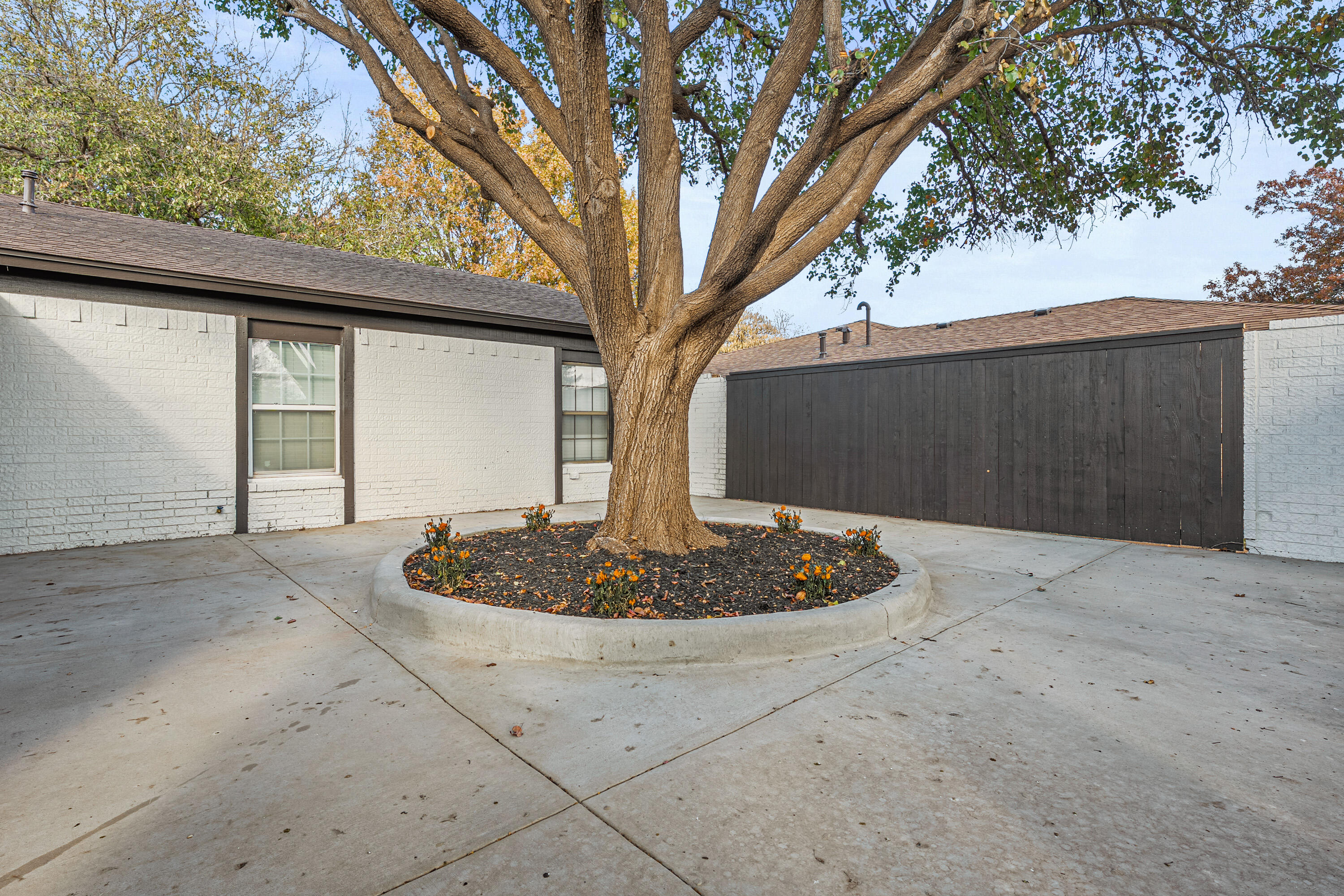 4510 77th Street Lubbock, TX 79424 - Photo 2 of 26 a front view of a house with a yard
