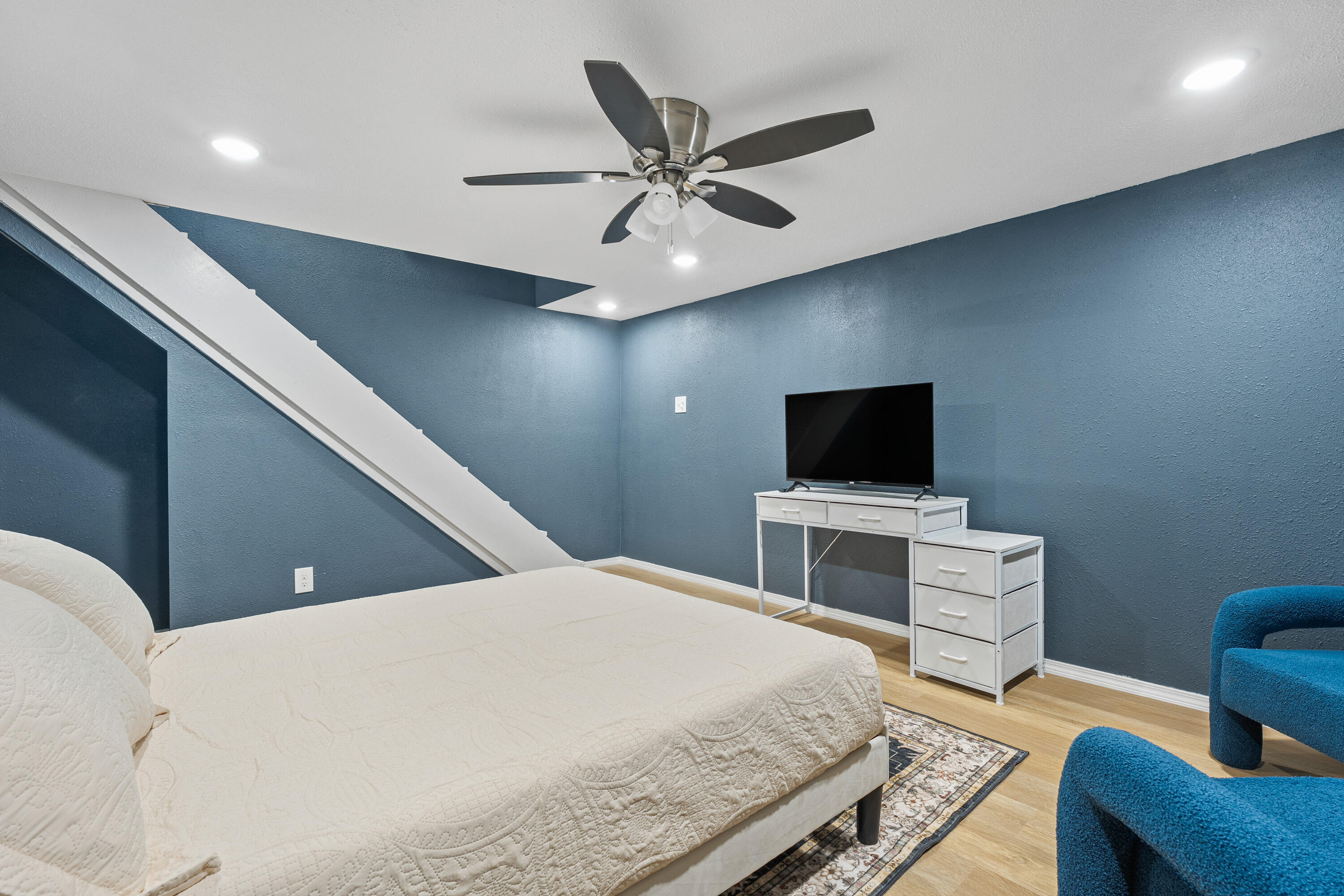 4510 77th Street Lubbock, TX 79424 - Photo 22 of 26 a living room with furniture and a flat screen tv