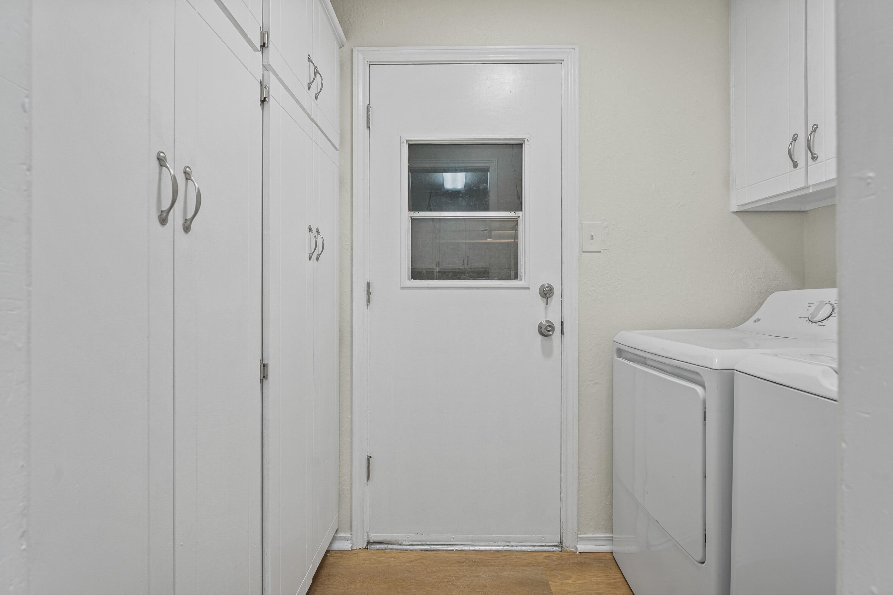 4510 77th Street Lubbock, TX 79424 - Photo 23 of 26 a view of storage and utility room with washer and dryer