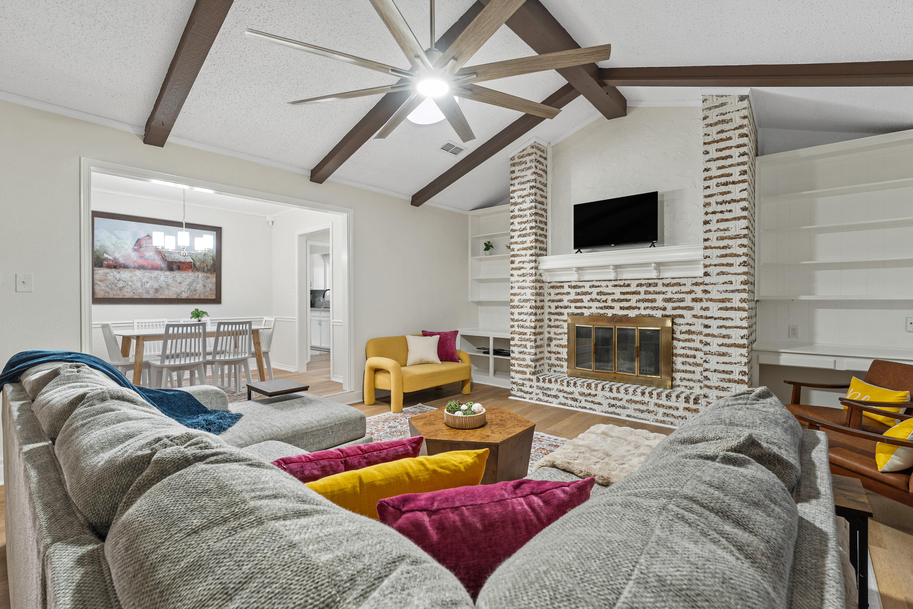 4510 77th Street Lubbock, TX 79424 - Photo 5 of 26 a living room with furniture and a flat screen tv