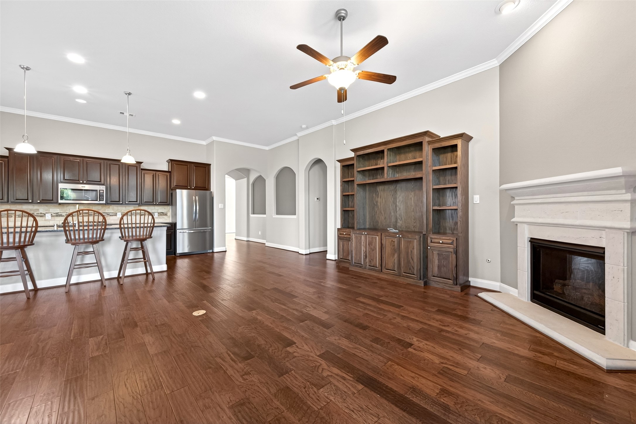 14 South Sawbridge Circle Spring, TX 77389 - Photo 12 of 45 a view of a livingroom with furniture a ceiling fan and wooden floor