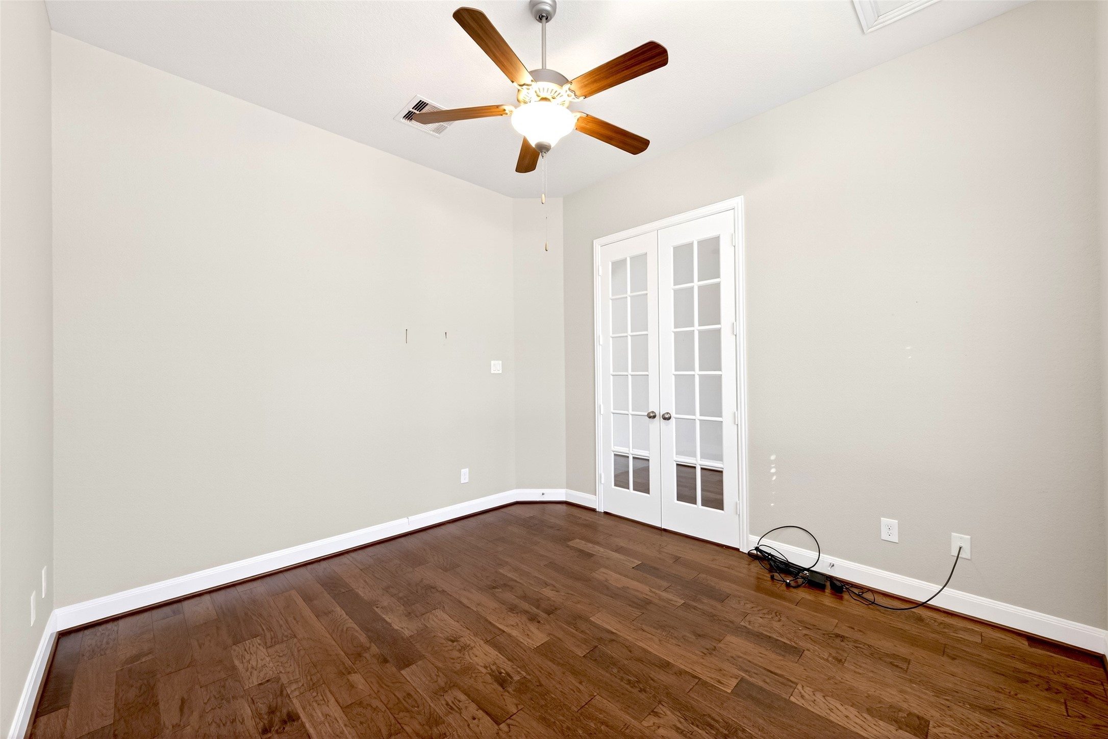 14 South Sawbridge Circle Spring, TX 77389 - Photo 26 of 45 an empty room with wooden floor and windows