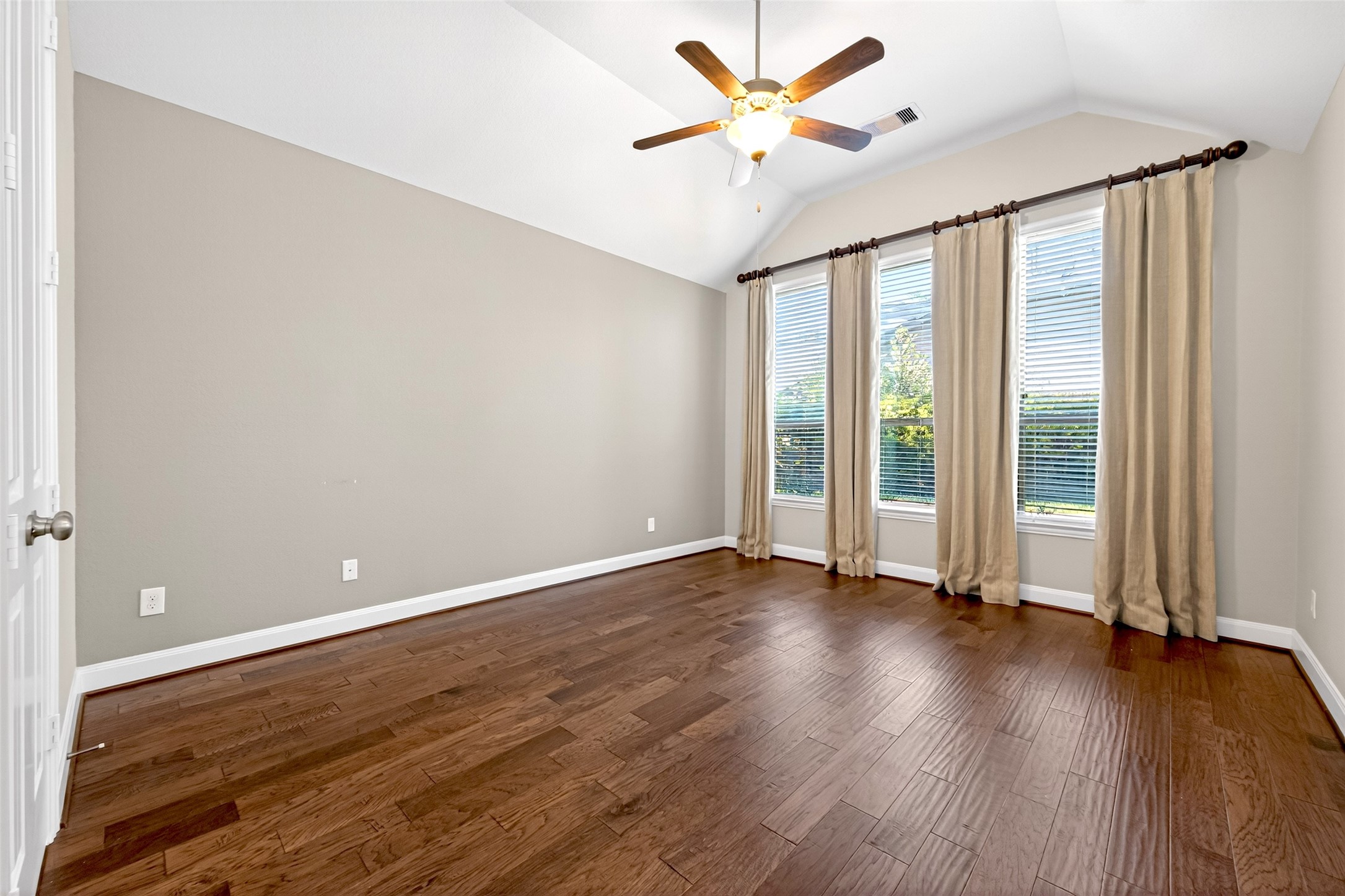 14 South Sawbridge Circle Spring, TX 77389 - Photo 29 of 45 an empty room with wooden floor and windows