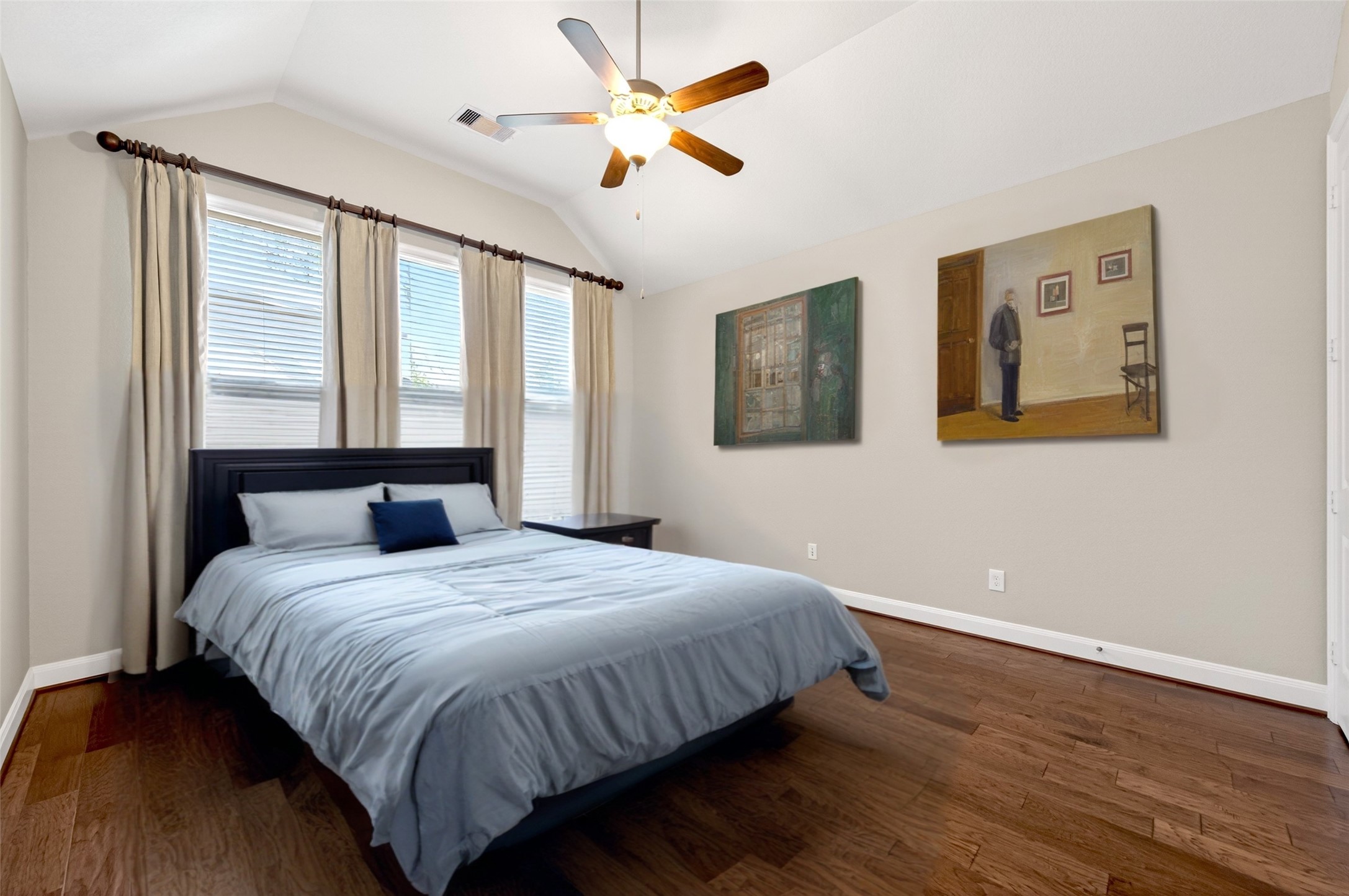 14 South Sawbridge Circle Spring, TX 77389 - Photo 30 of 45 a bedroom with a large bed and a chandelier