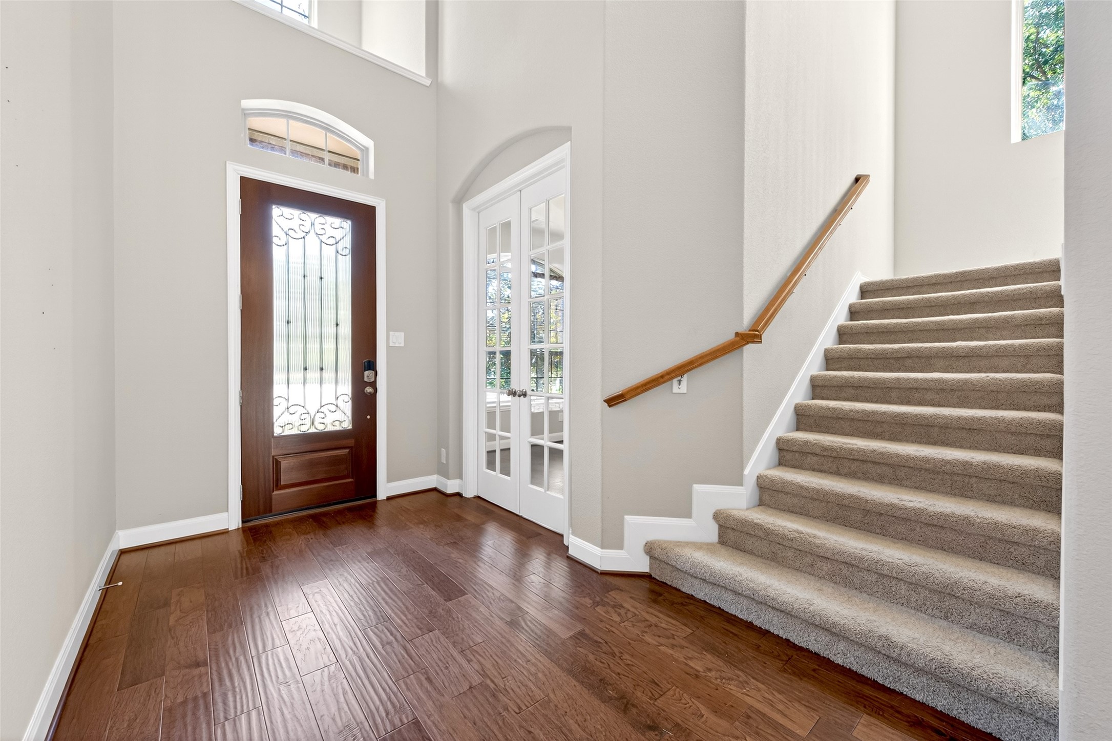 14 South Sawbridge Circle Spring, TX 77389 - Photo 4 of 45 a view of entryway with wooden floor and stairs