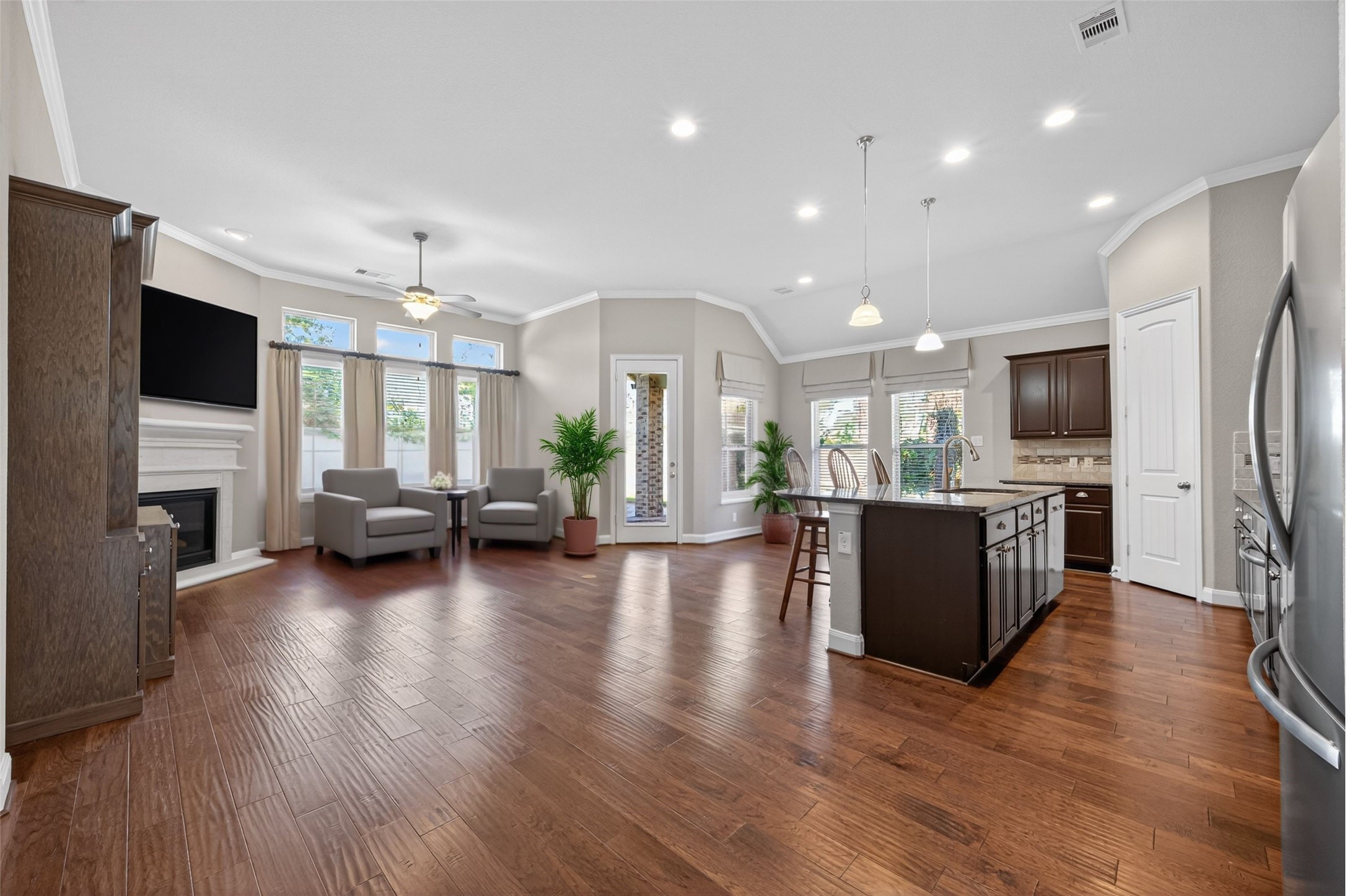 14 South Sawbridge Circle Spring, TX 77389 - Photo 8 of 45 a living room with fireplace furniture and a flat screen tv