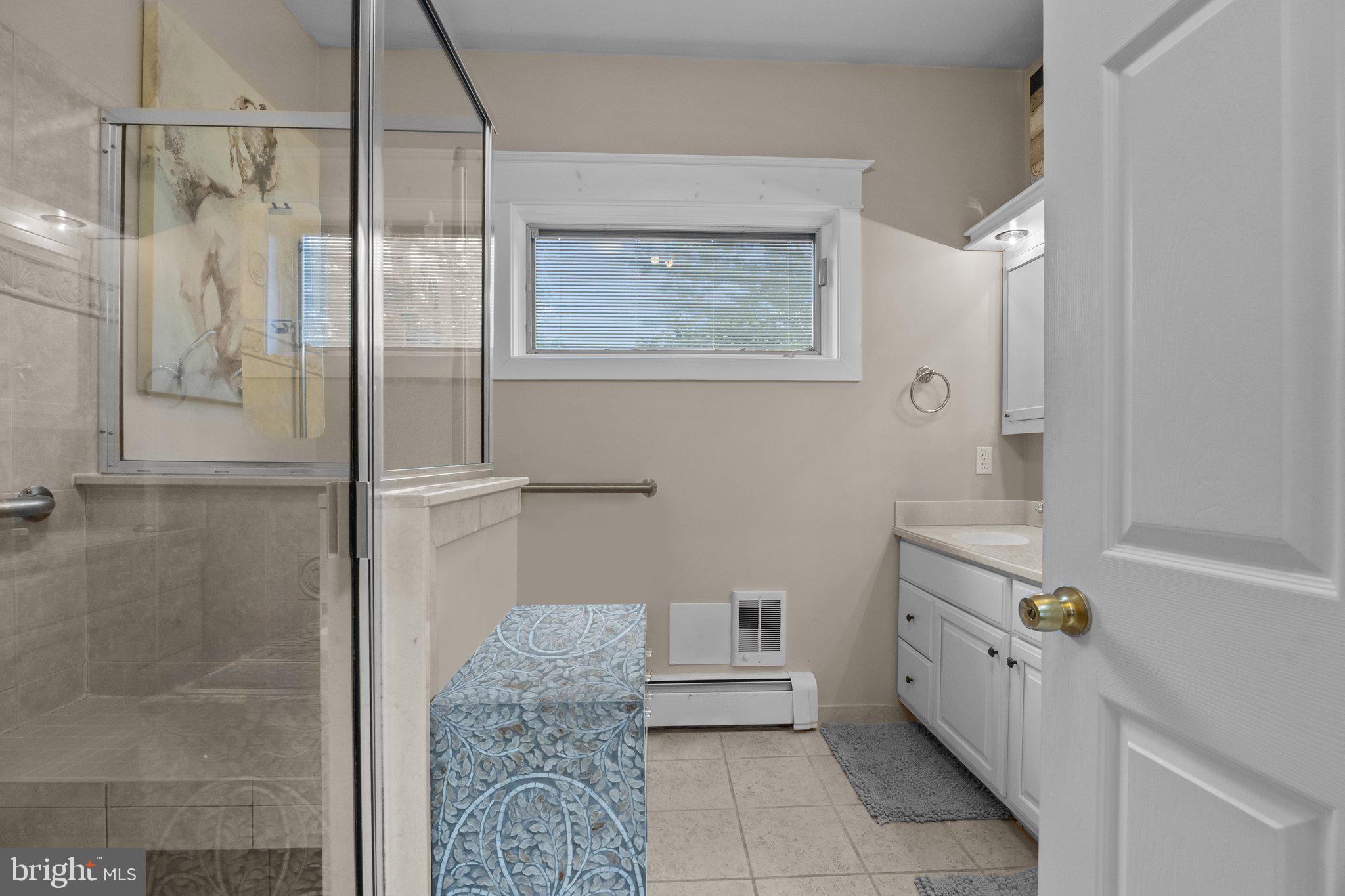 600 Runnymede Avenue Jenkintown, PA 19046 - Photo 14 of 51 a bathroom with a granite countertop sink a toilet and shower