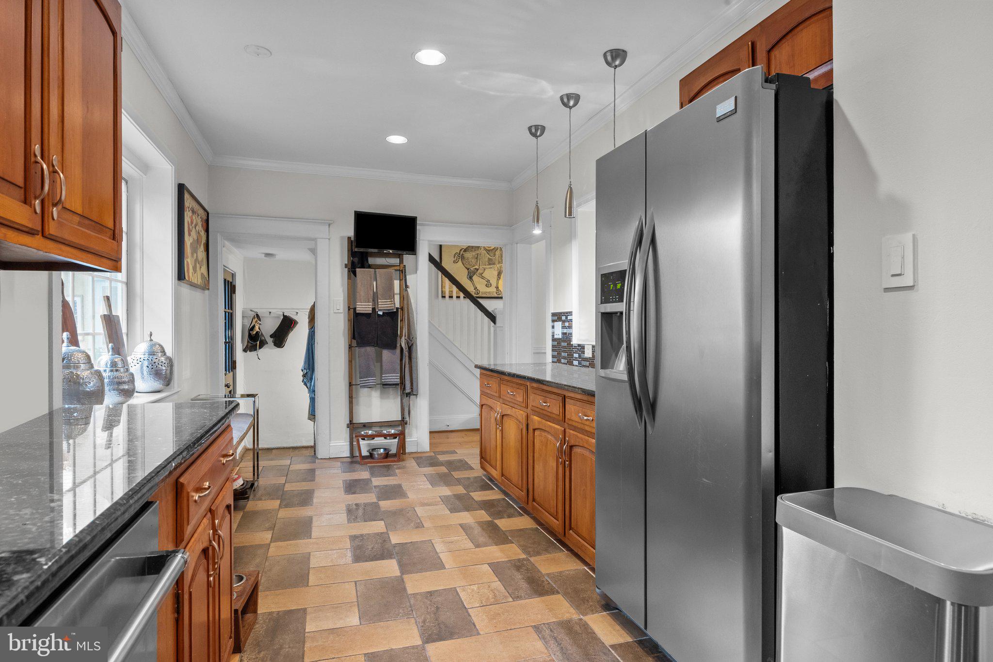 600 Runnymede Avenue Jenkintown, PA 19046 - Photo 22 of 51 a kitchen with stainless steel appliances granite countertop a refrigerator and a sink