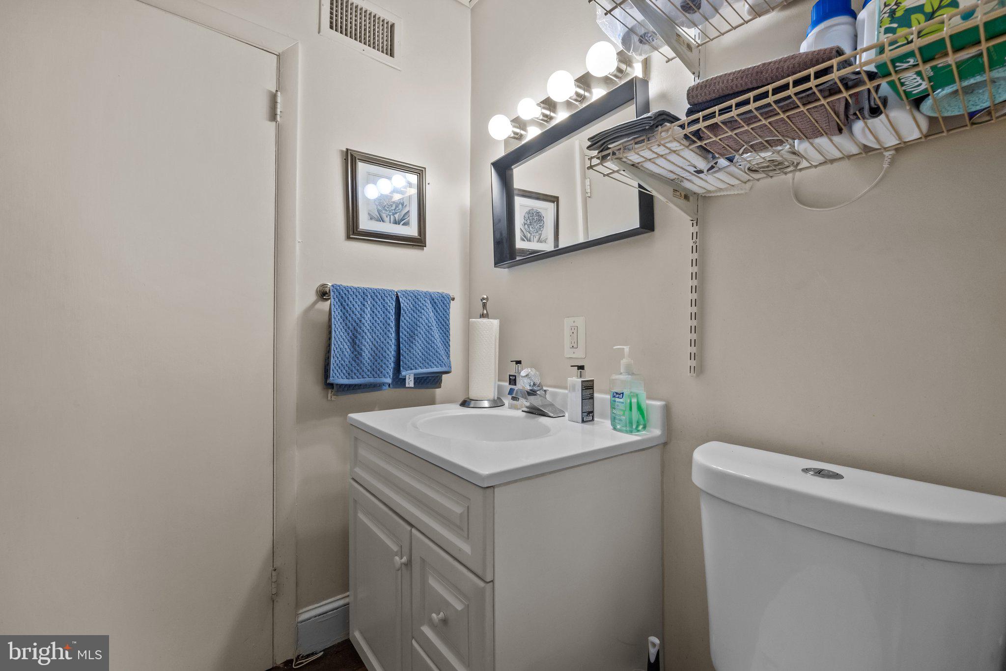 600 Runnymede Avenue Jenkintown, PA 19046 - Photo 23 of 51 a bathroom with a sink a vanity and a mirror