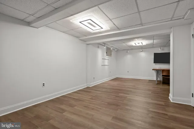 a room with furniture and a wooden floor