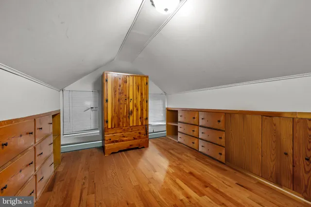 a bathroom with a sink toilet a mirror and window