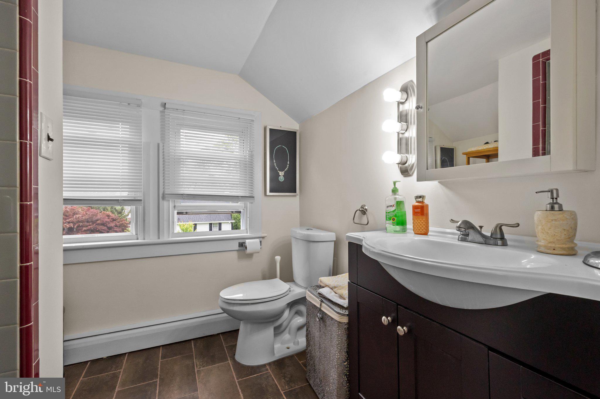 600 Runnymede Avenue Jenkintown, PA 19046 - Photo 38 of 51 a bathroom with a sink toilet a mirror and window