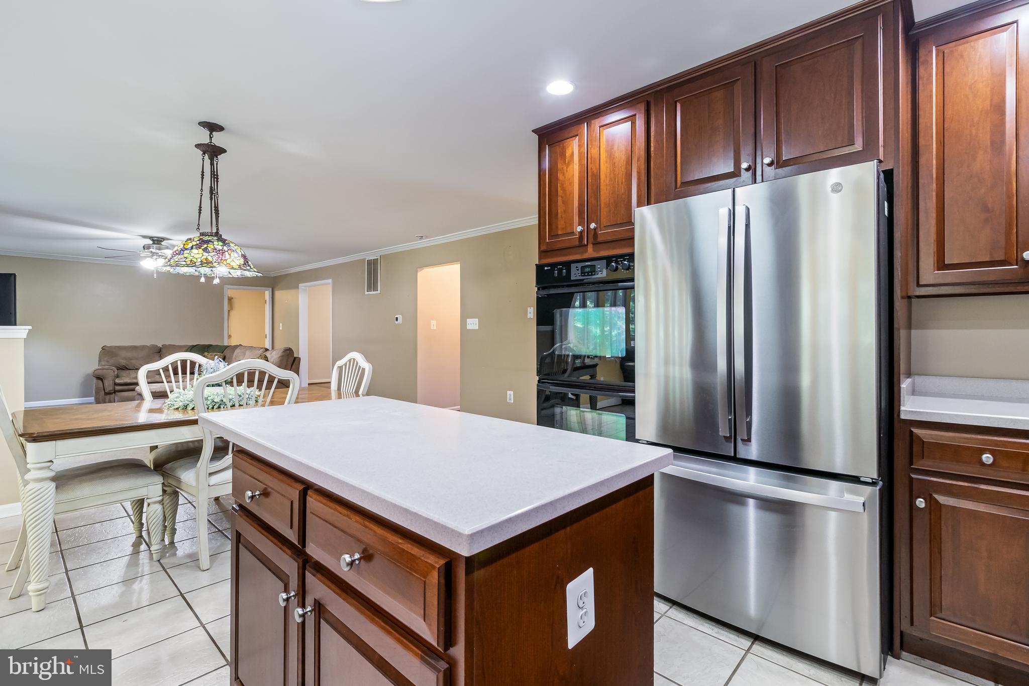203 Morgans Ridge Court La Plata, MD 20646 - Photo 11 of 59 a kitchen with kitchen island a counter top space appliances and cabinets