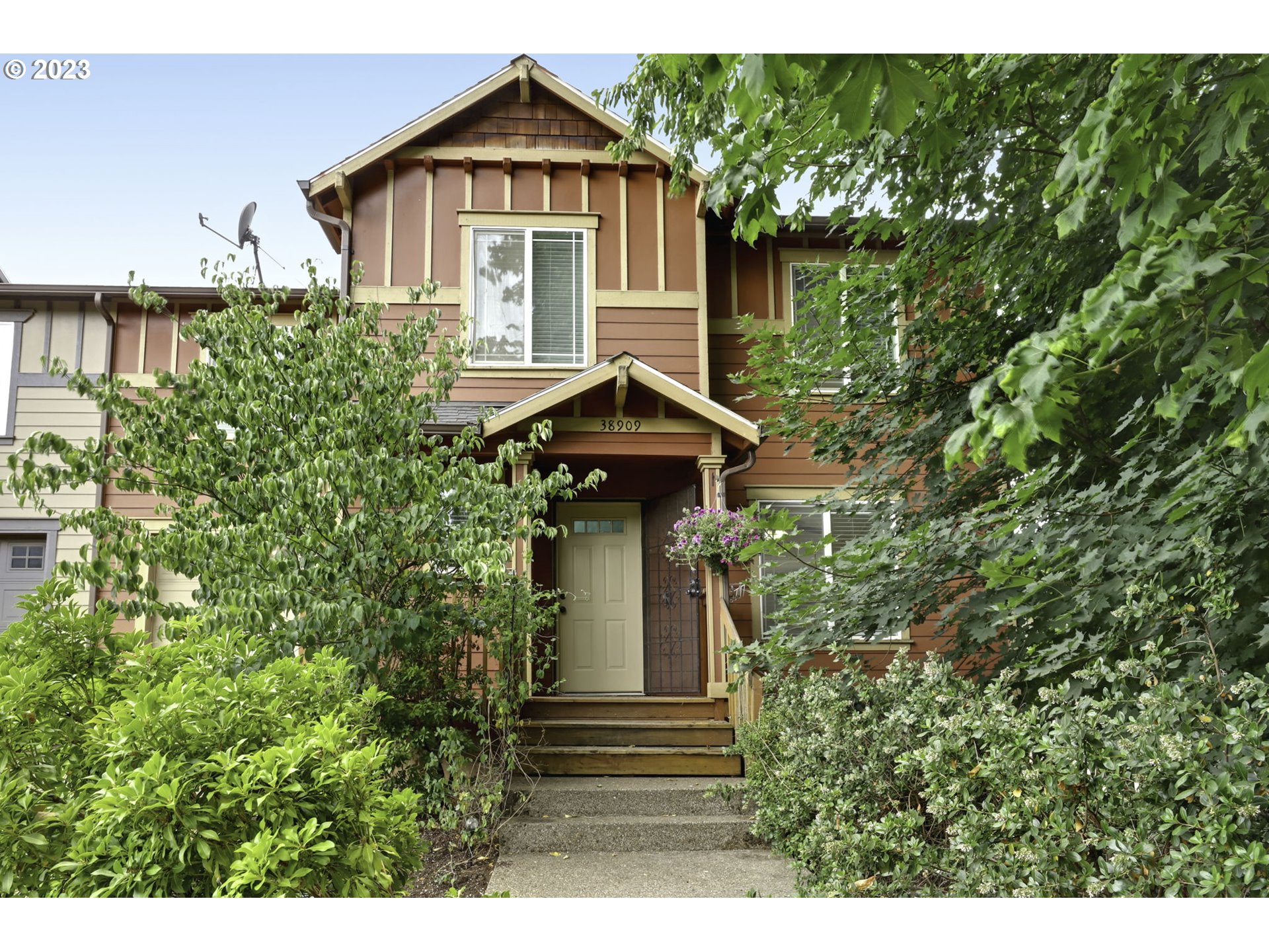 a front view of a house with a yard