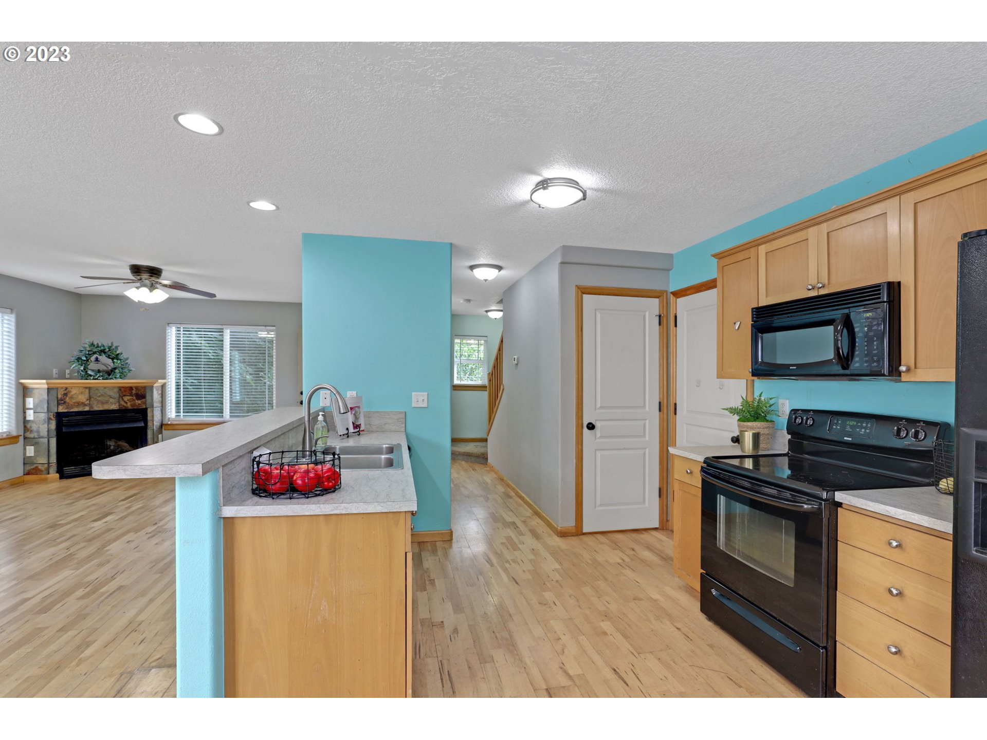 38909 Sandy Heights Street Sandy, OR 97055 - Photo 11 of 33 a kitchen that has a lot of cabinets a sink and appliances