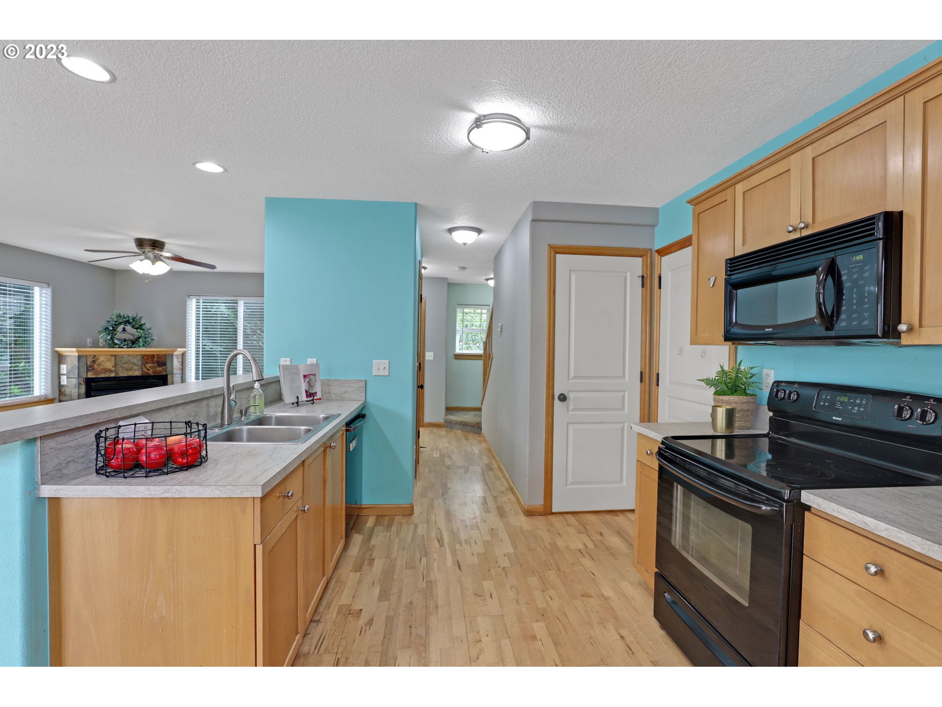 38909 Sandy Heights Street Sandy, OR 97055 - Photo 12 of 33 a kitchen with a sink stove and cabinets