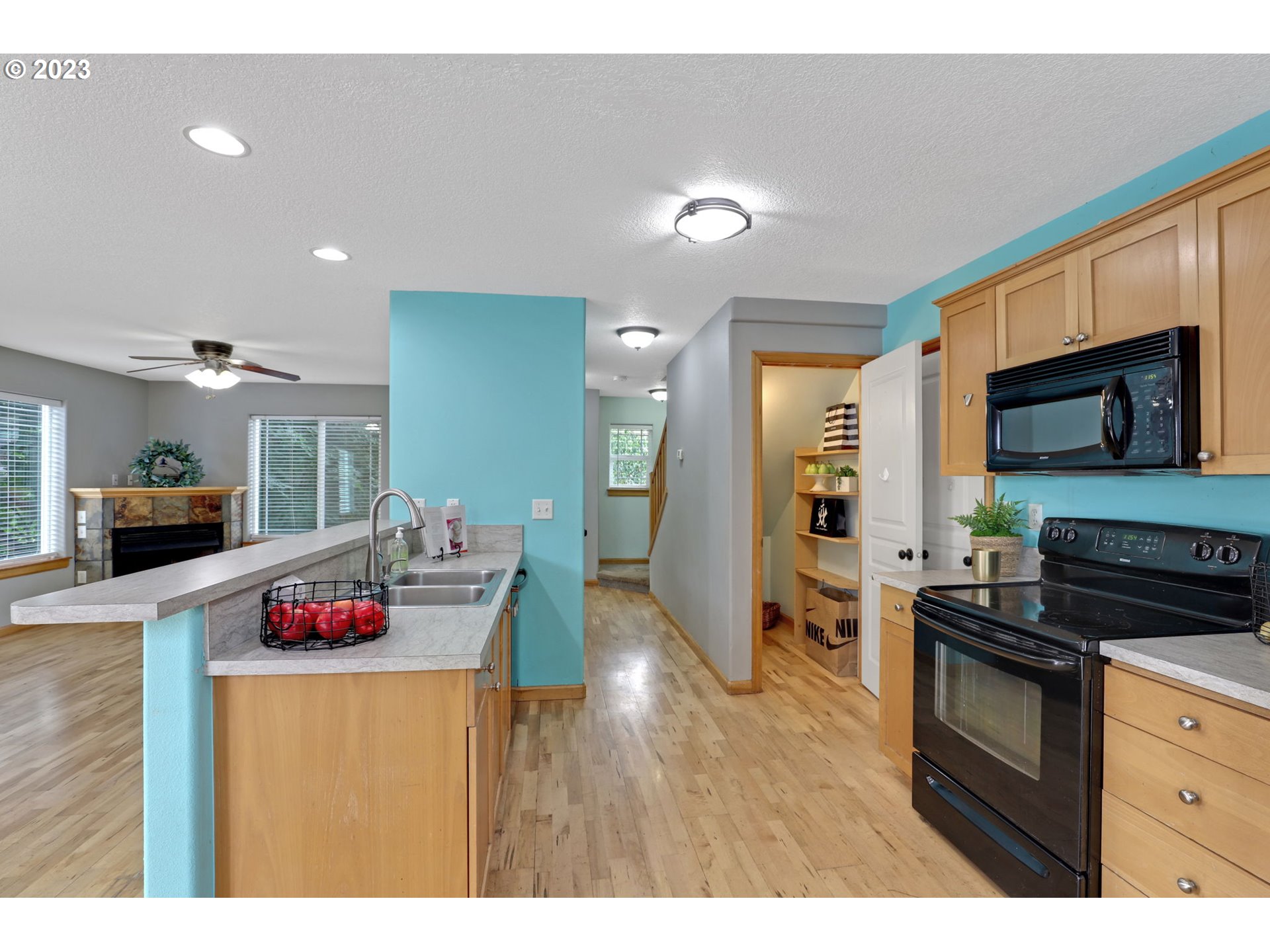 38909 Sandy Heights Street Sandy, OR 97055 - Photo 13 of 33 a kitchen with granite countertop sink stainless steel appliances and cabinets
