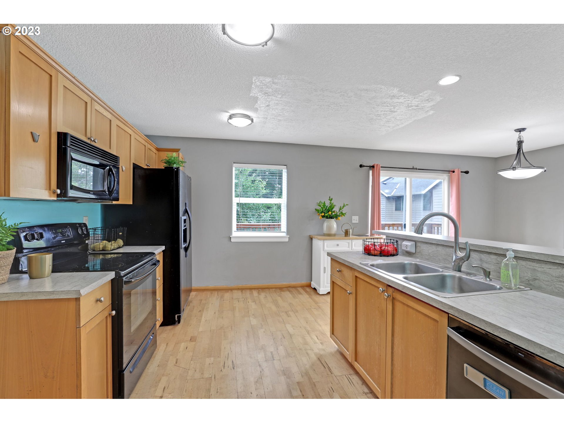 38909 Sandy Heights Street Sandy, OR 97055 - Photo 14 of 33 a kitchen with a sink stove and refrigerator