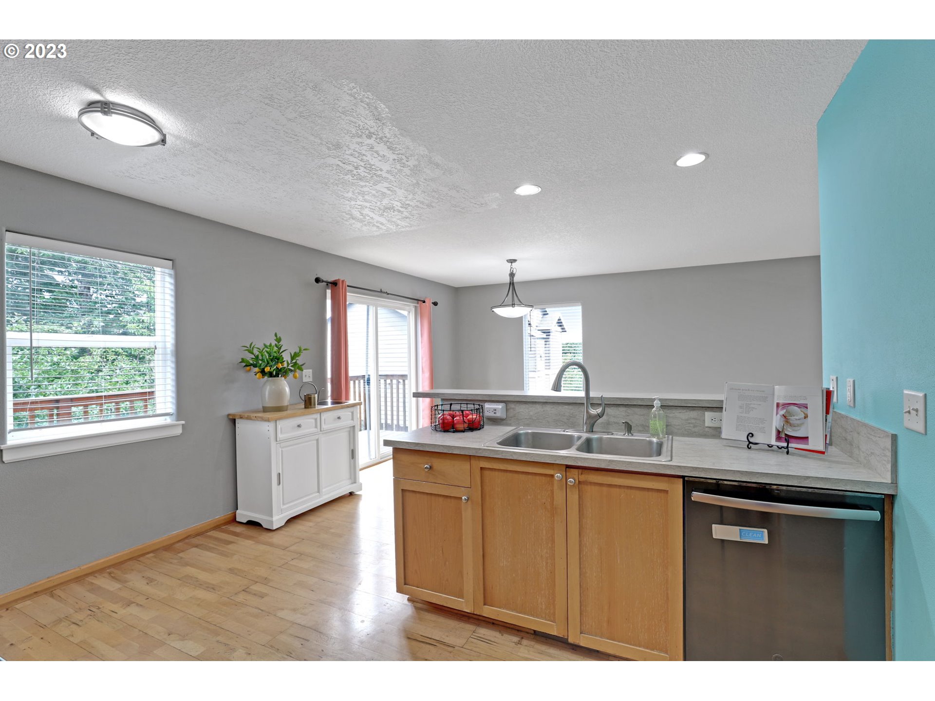 38909 Sandy Heights Street Sandy, OR 97055 - Photo 16 of 33 a kitchen with a sink and dishwasher with wooden floor