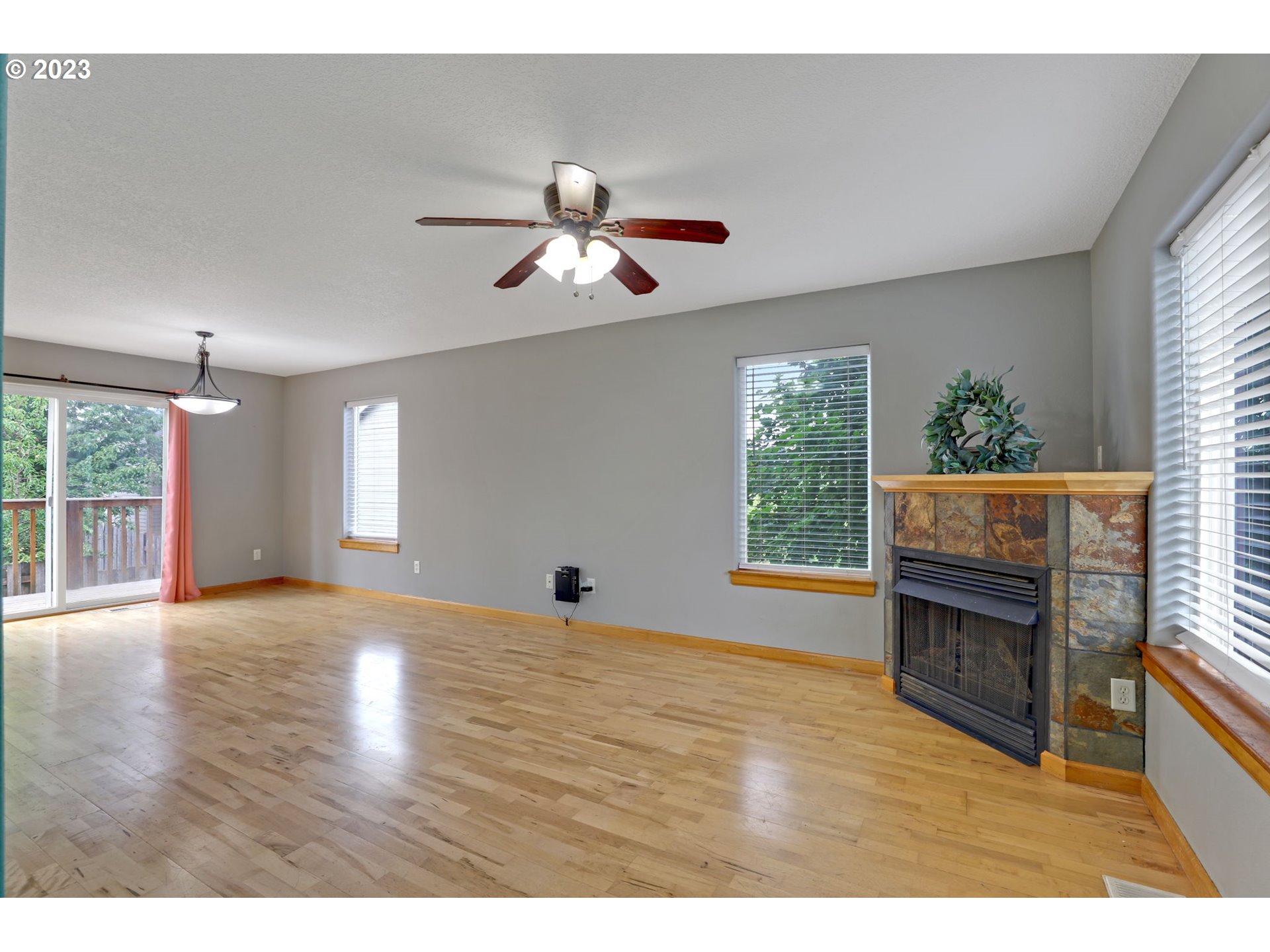 38909 Sandy Heights Street Sandy, OR 97055 - Photo 2 of 33 a view of an empty room with a window and wooden floor