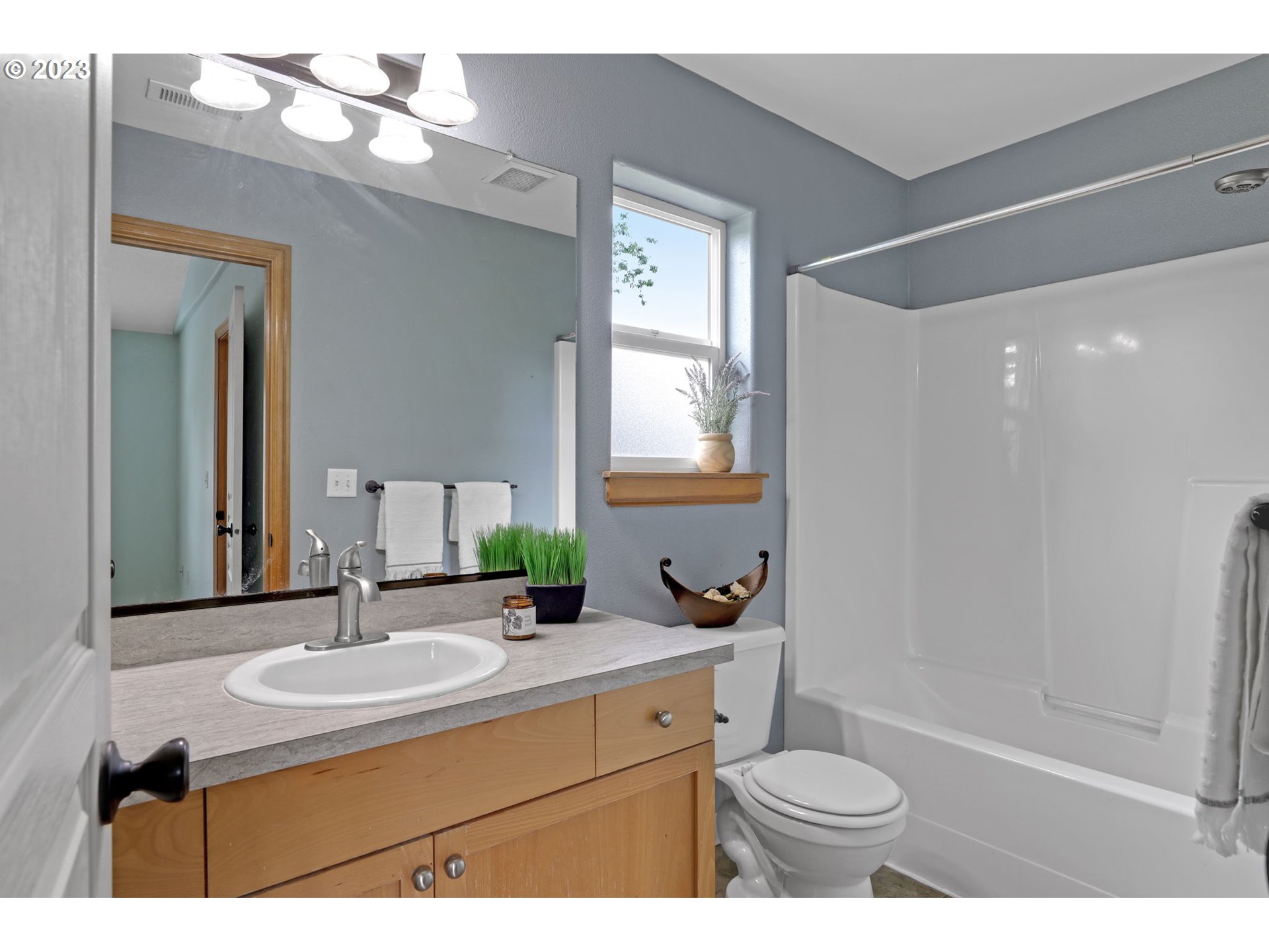 38909 Sandy Heights Street Sandy, OR 97055 - Photo 21 of 33 a bathroom with a sink toilet a mirror and shower