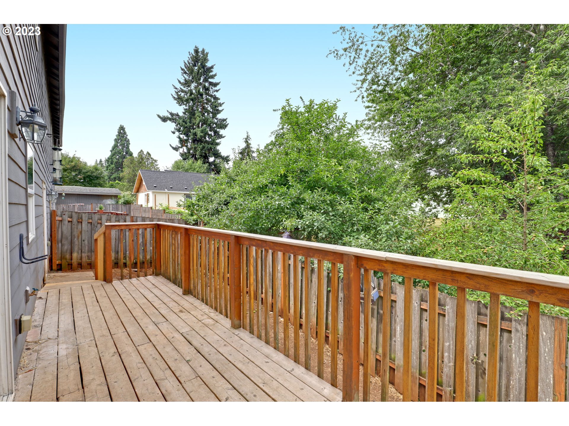 38909 Sandy Heights Street Sandy, OR 97055 - Photo 28 of 33 a balcony with wooden floor and yard in the back