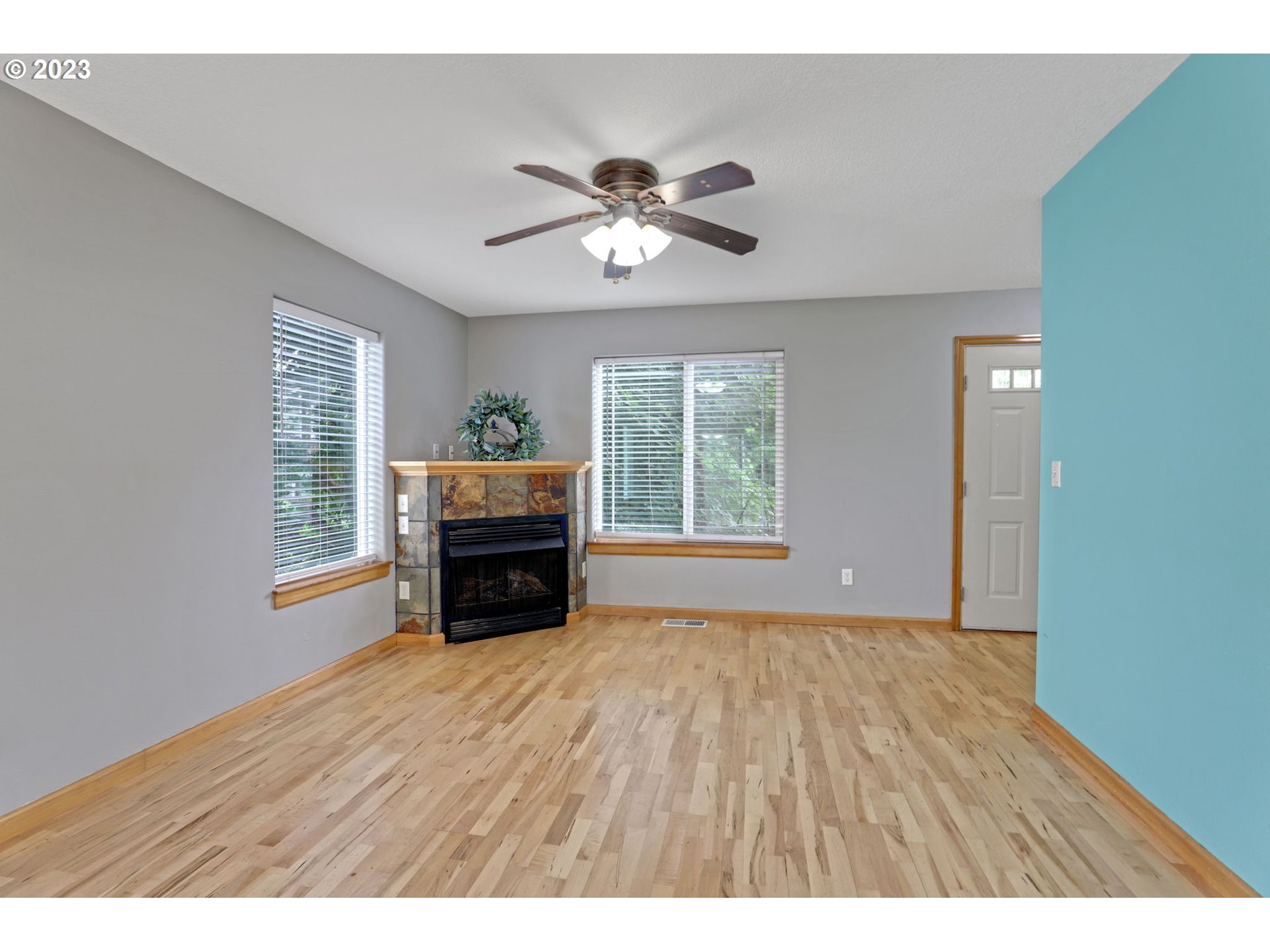 38909 Sandy Heights Street Sandy, OR 97055 - Photo 3 of 33 a view of empty room with wooden floor and fan
