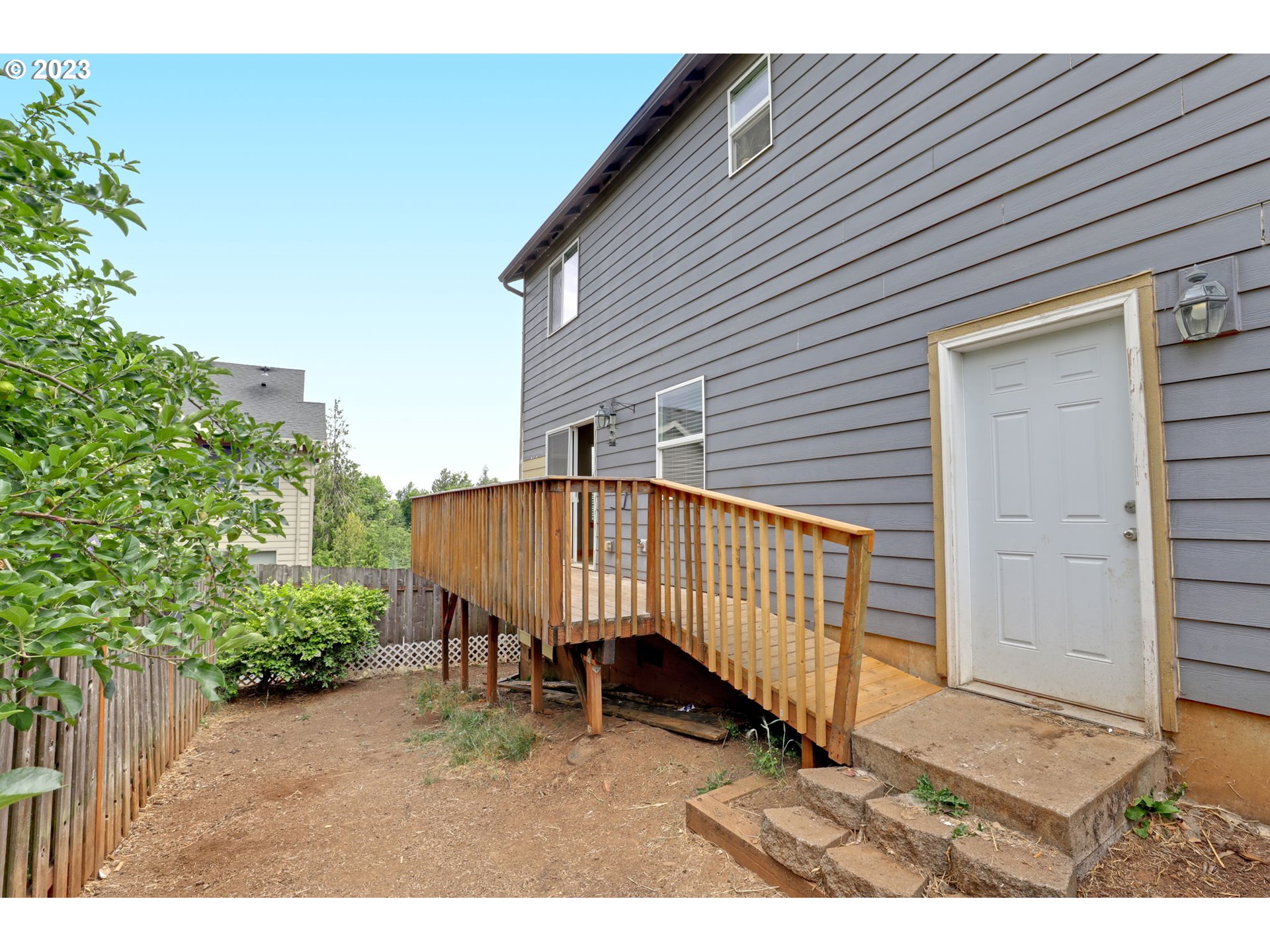 38909 Sandy Heights Street Sandy, OR 97055 - Photo 31 of 33 a backyard of a house with a garden and deck