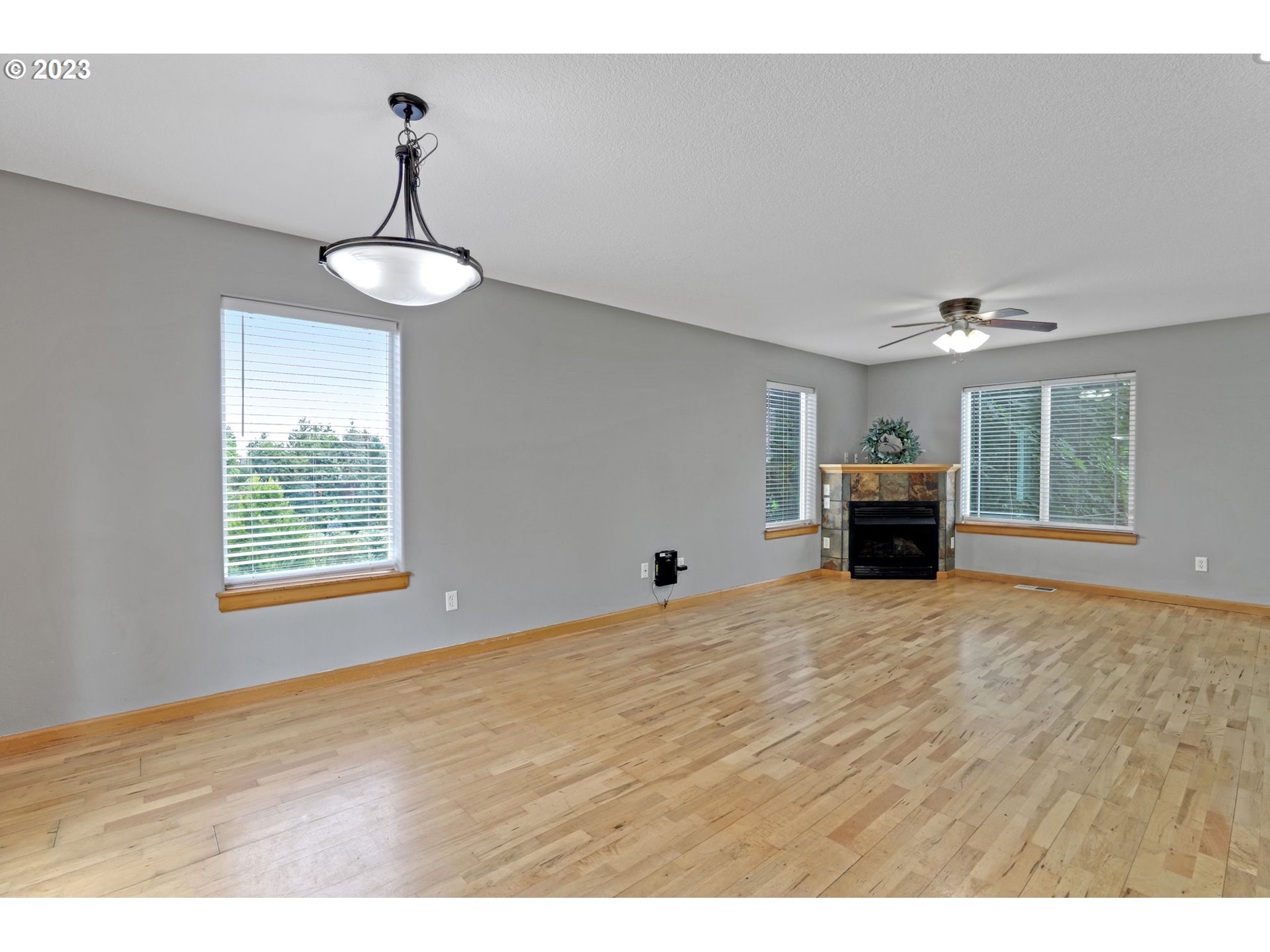 38909 Sandy Heights Street Sandy, OR 97055 - Photo 4 of 33 a view of empty room with window and chandelier