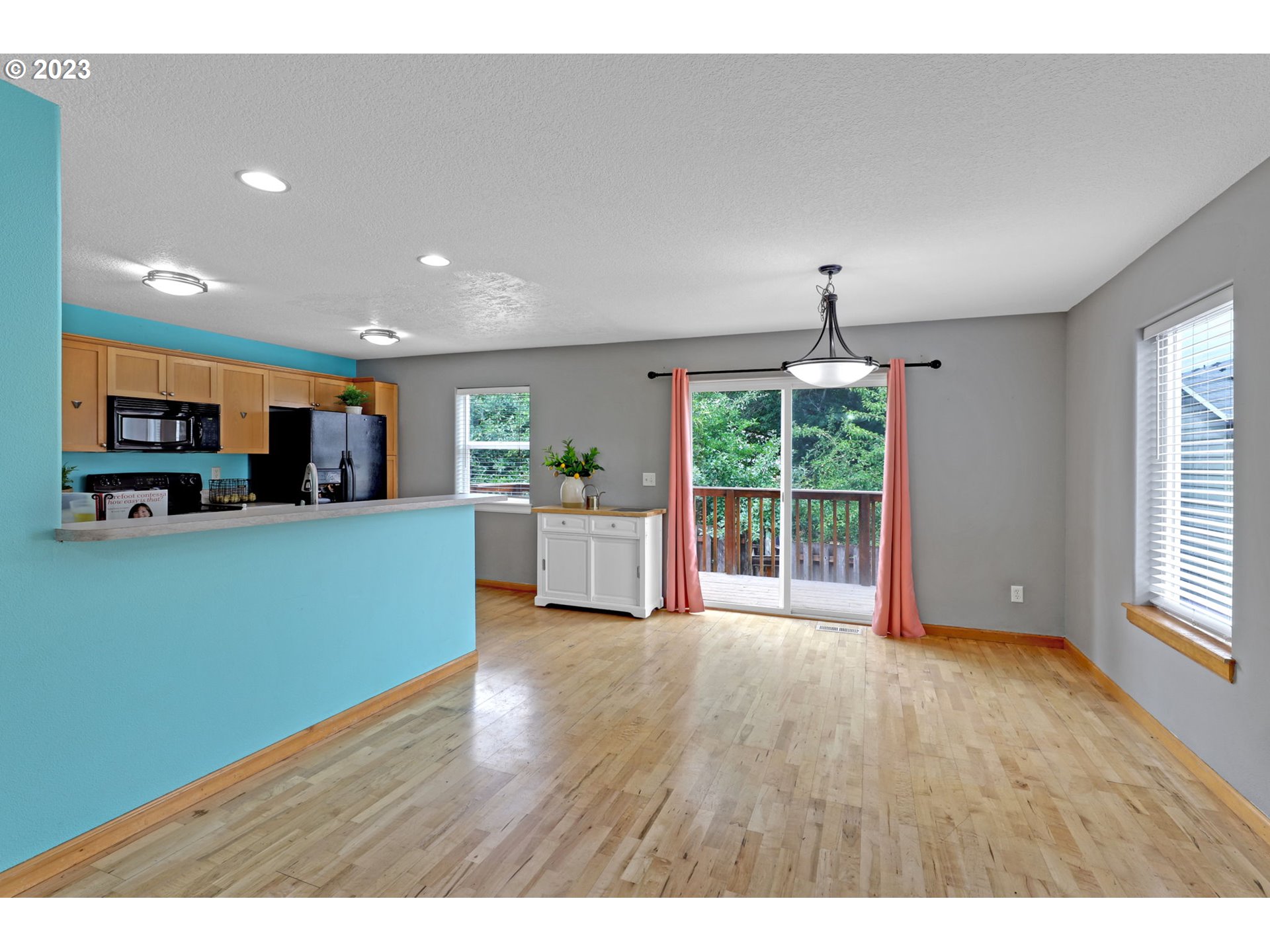 38909 Sandy Heights Street Sandy, OR 97055 - Photo 7 of 33 a open kitchen with window and wooden floor