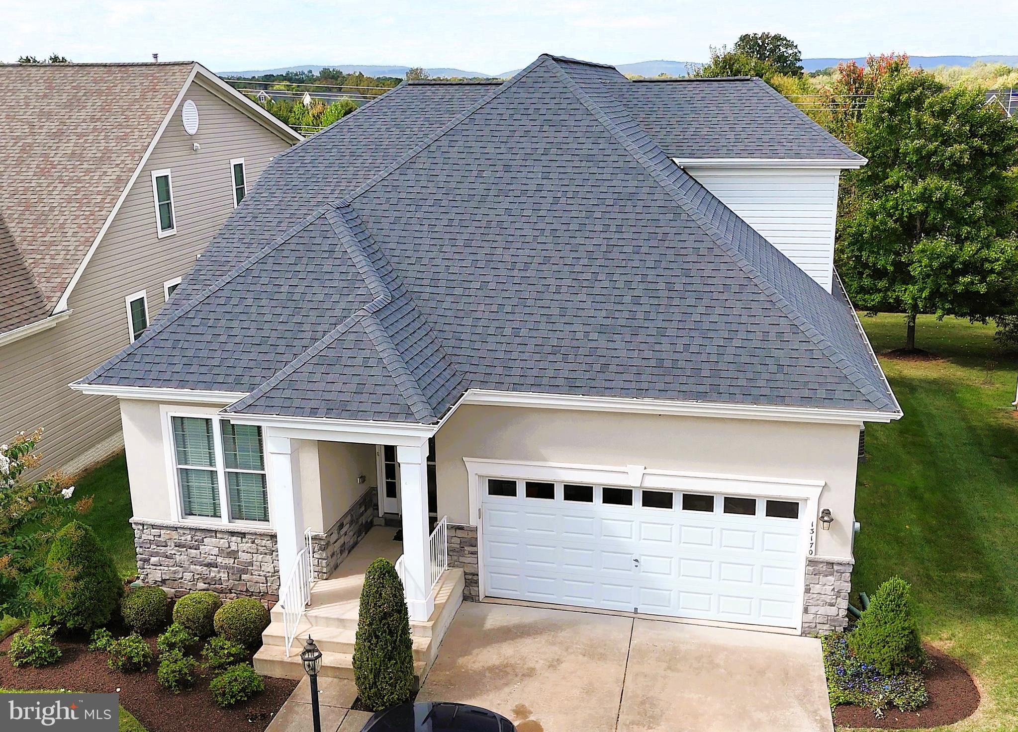 13170 Triple Crown Loop Gainesville, VA 20155 - Photo 68 of 71 a front view of a house with a yard