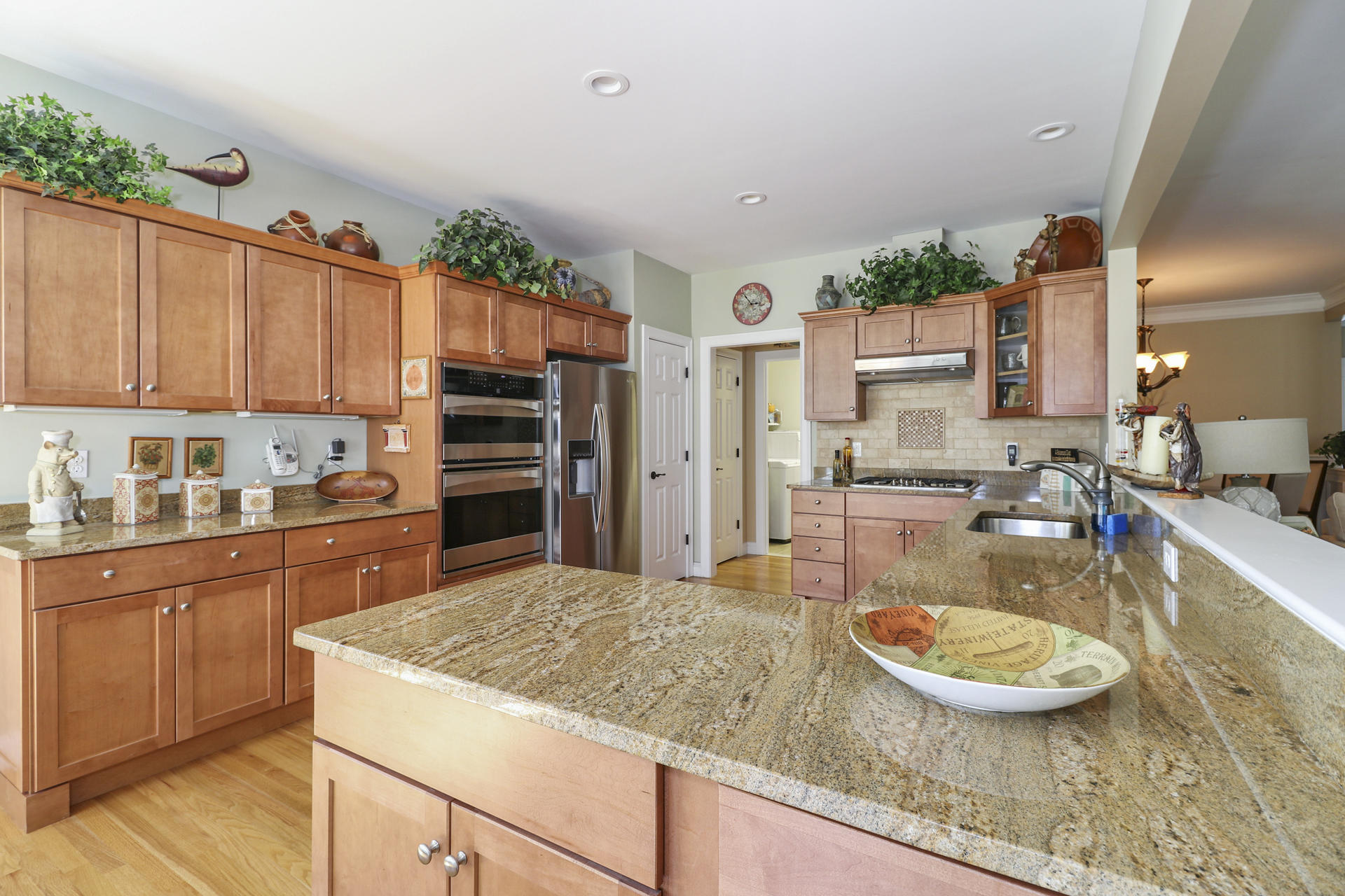 25 Dacey Drive Centerville, MA 02632 - Photo 12 of 40 a kitchen with kitchen island a stove a sink and a refrigerator