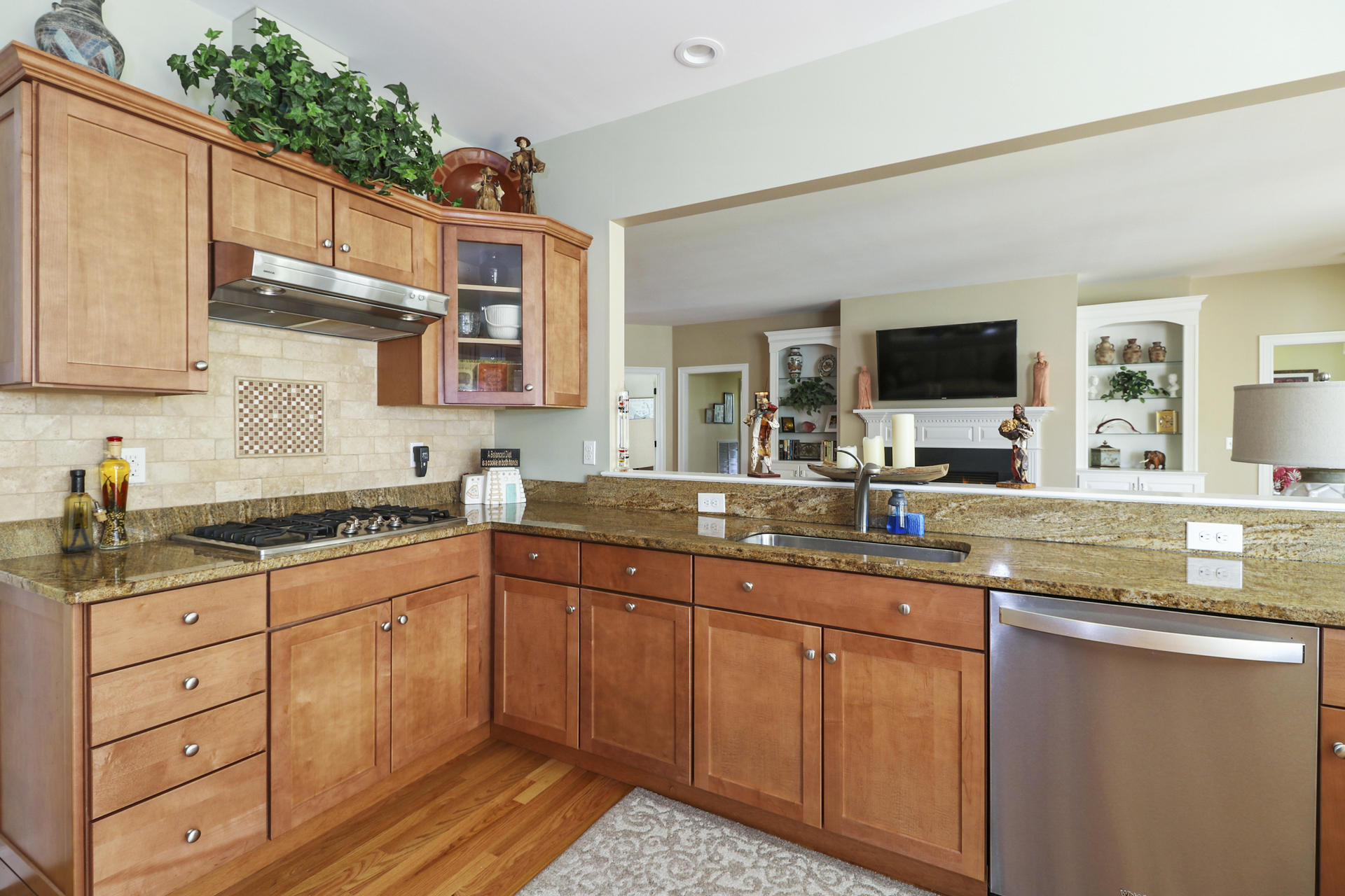 25 Dacey Drive Centerville, MA 02632 - Photo 13 of 40 a kitchen with stainless steel appliances granite countertop a sink stove and cabinets
