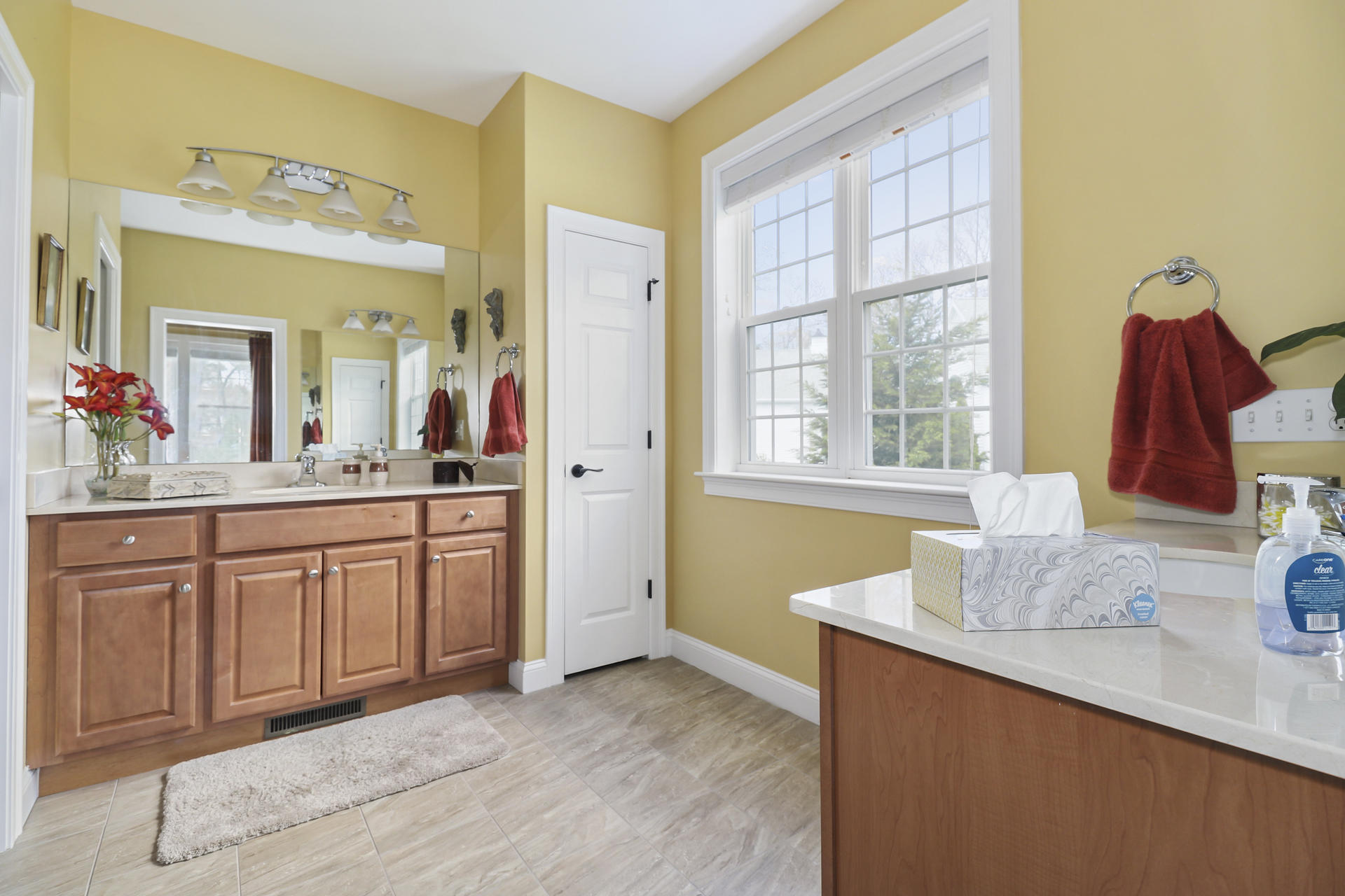 25 Dacey Drive Centerville, MA 02632 - Photo 24 of 40 a spacious bathroom with a granite countertop sink and a large mirror