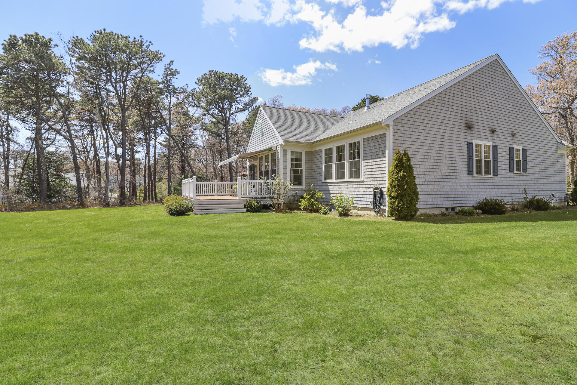 25 Dacey Drive Centerville, MA 02632 - Photo 32 of 40 a front view of house with yard and green space
