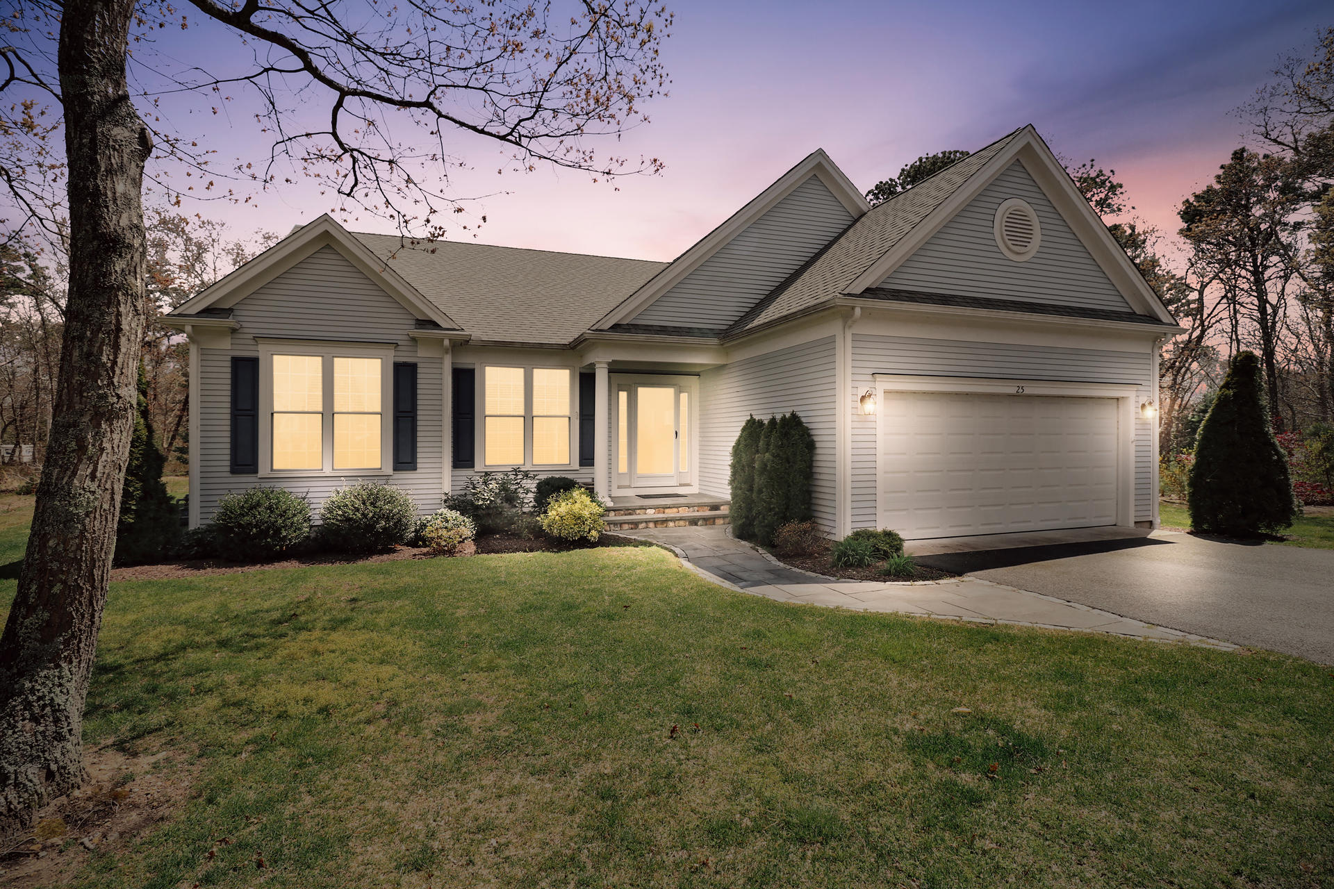25 Dacey Drive Centerville, MA 02632 - Photo 33 of 40 a front view of a house with a yard and garage