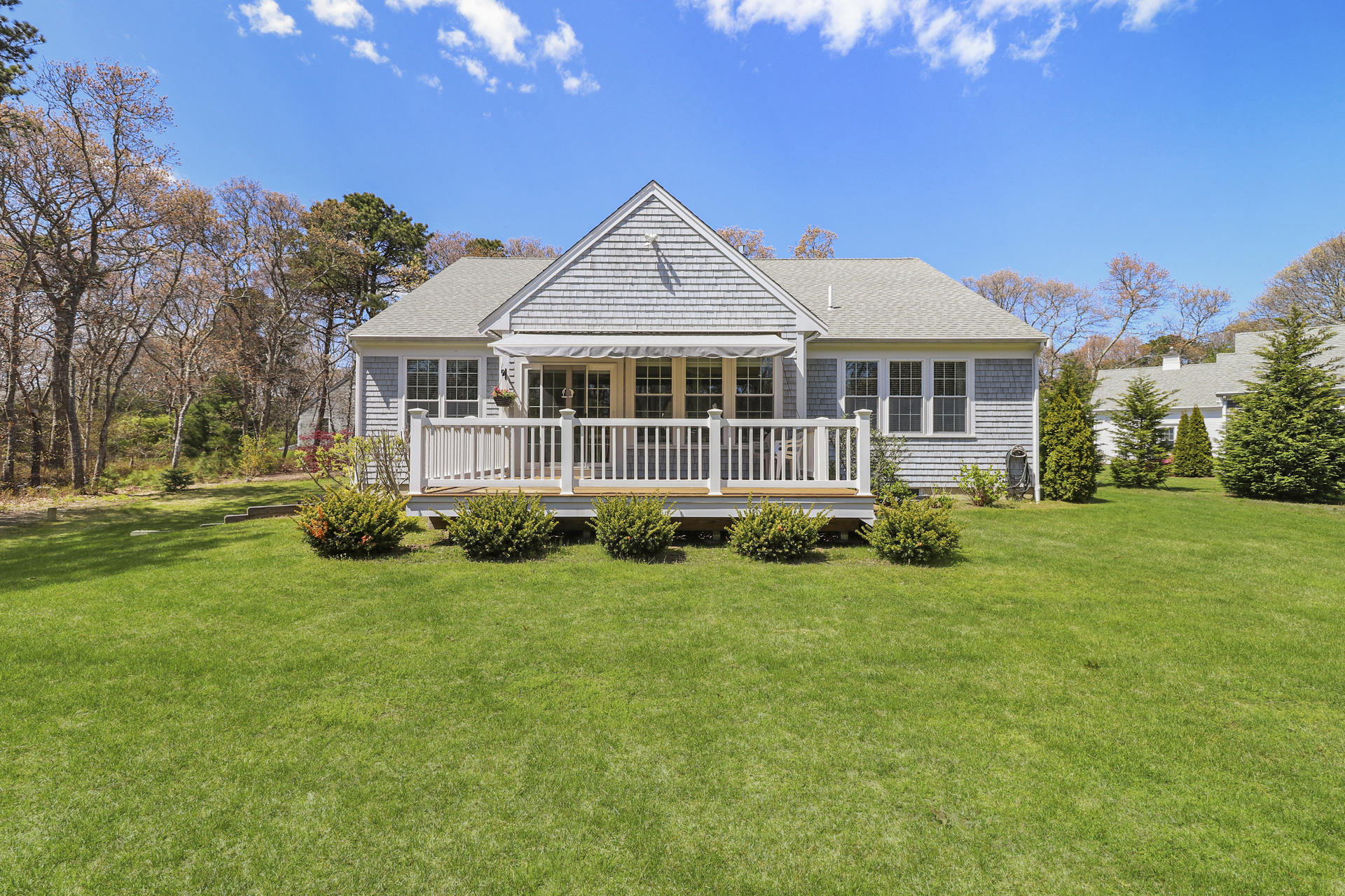 25 Dacey Drive Centerville, MA 02632 - Photo 34 of 40 a front view of a house with a garden