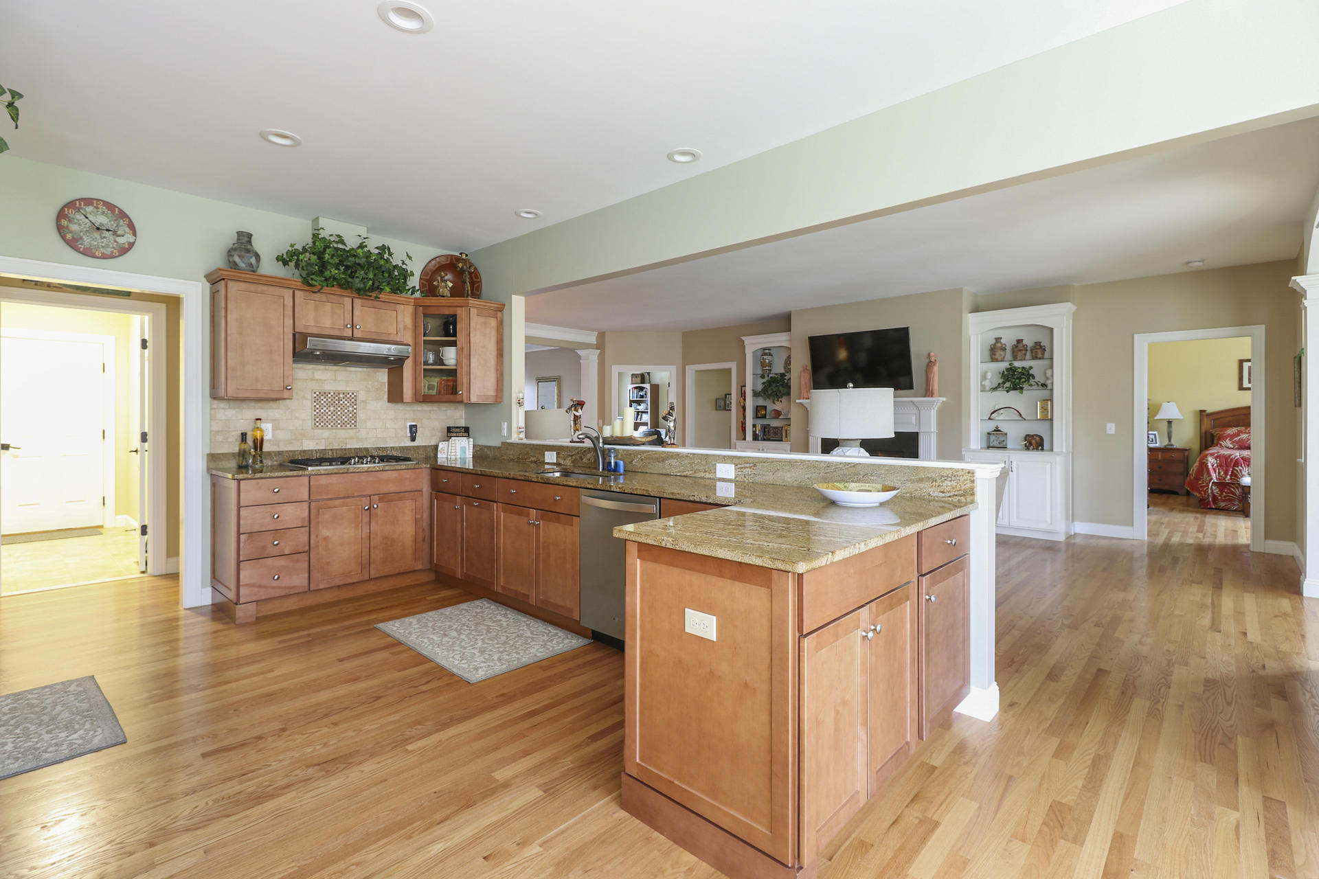25 Dacey Drive Centerville, MA 02632 - Photo 10 of 40 a kitchen with stainless steel appliances granite countertop a stove and a wooden floors