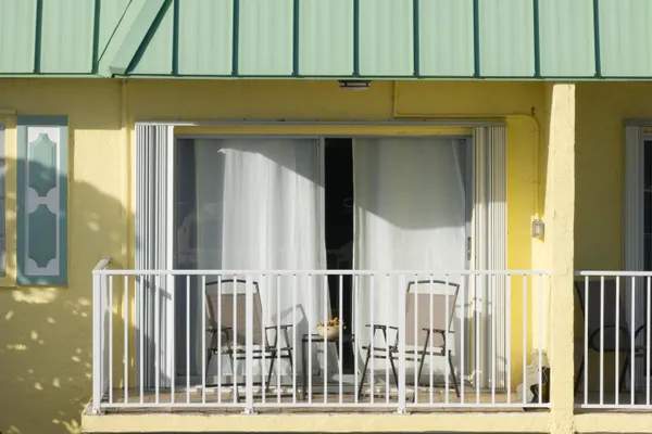 a view of a balcony with an outdoor