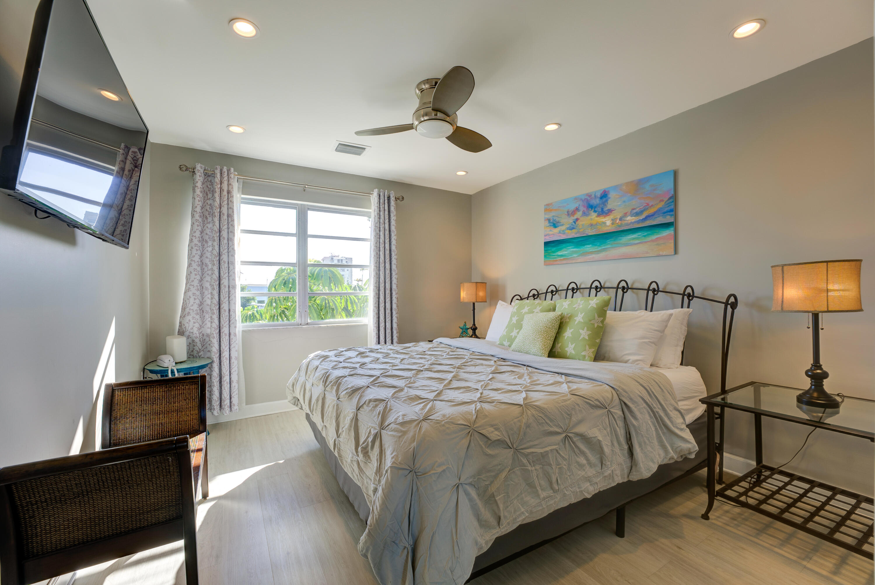 105 Ave D, Unit 113 Marathon, FL 33050 - Photo 3 of 26 a bedroom with a bed and wooden floor