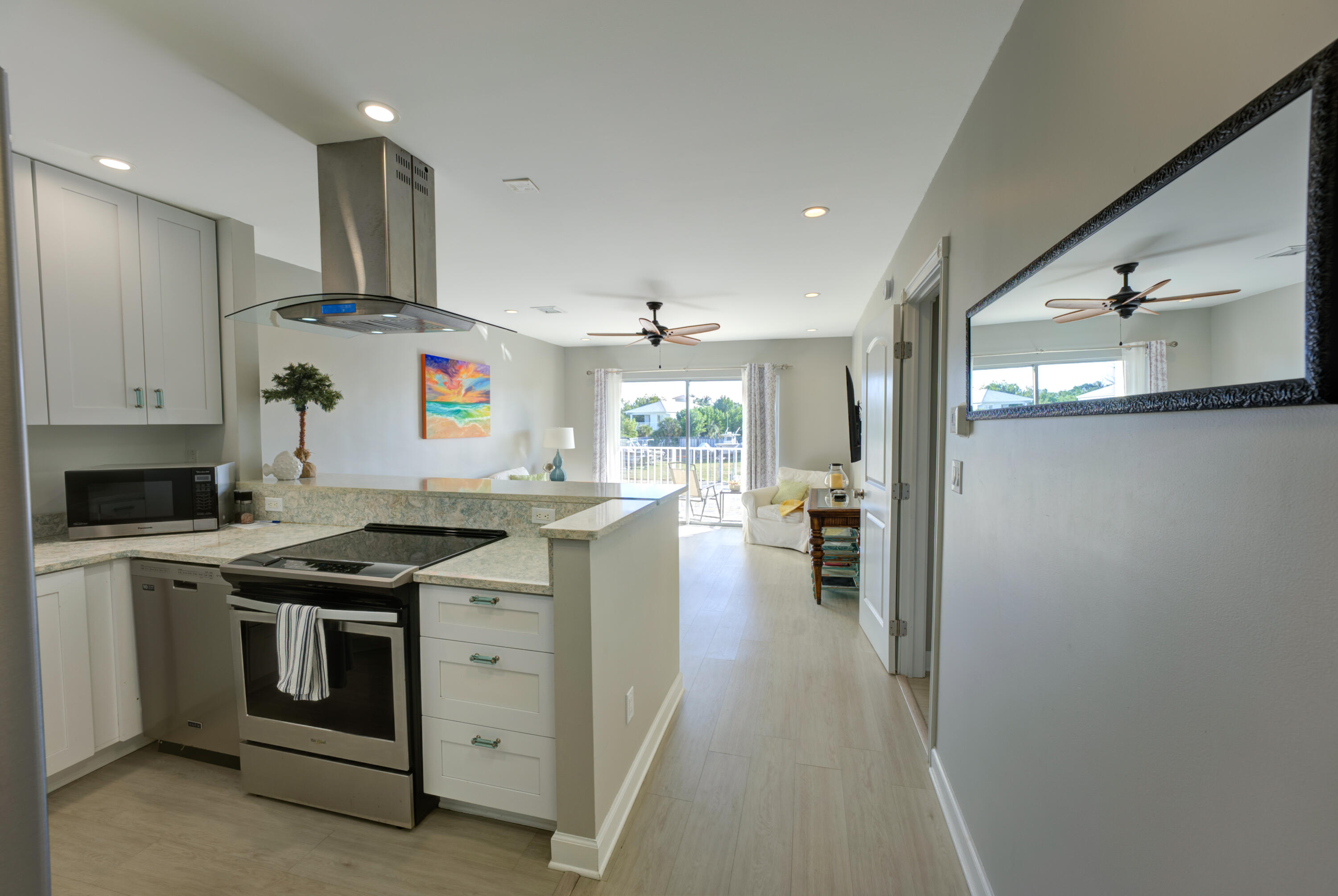 105 Ave D, Unit 113 Marathon, FL 33050 - Photo 4 of 26 a kitchen with stainless steel appliances granite countertop a stove and a sink