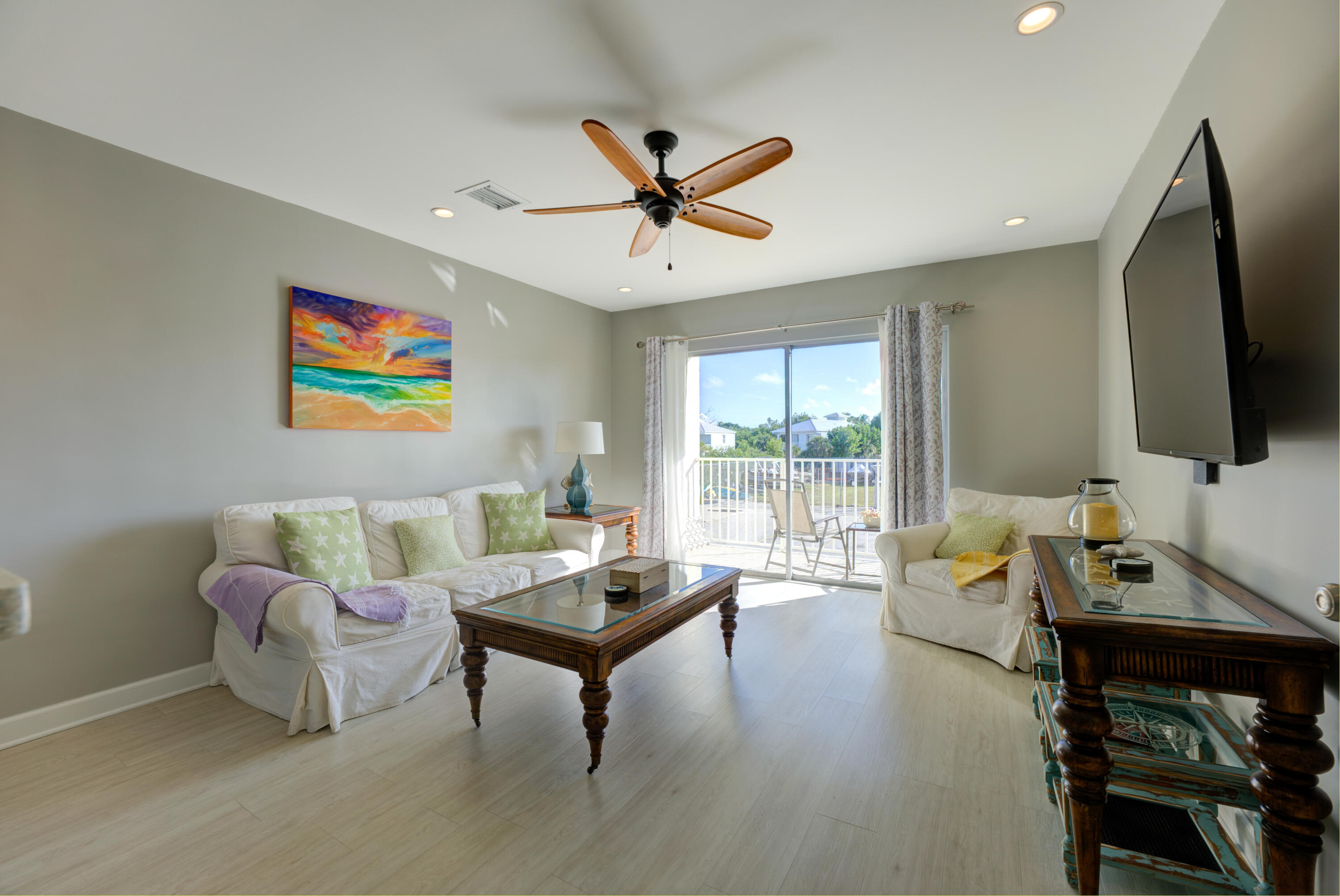 105 Ave D, Unit 113 Marathon, FL 33050 - Photo 5 of 26 a living room with furniture and a flat screen tv