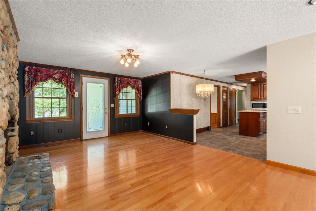 2035 Parker Street Springfield, MA 01128 - Photo 11 of 42 a view of an empty room with a window and a kitchen