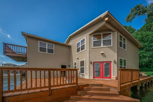 a front view of a house with wooden stairs