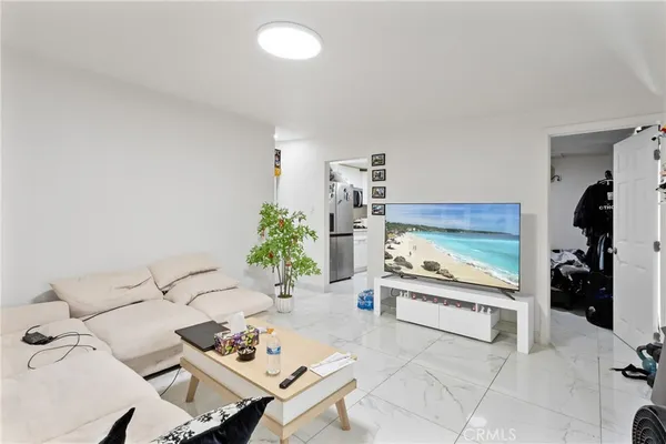 a kitchen with stainless steel appliances granite countertop a sink a stove and cabinets