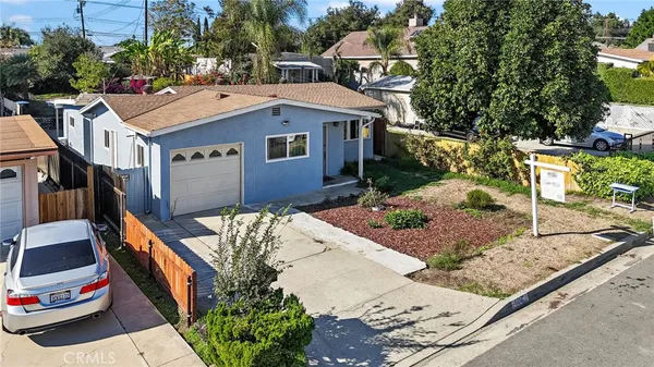 a aerial view of a house with a yard