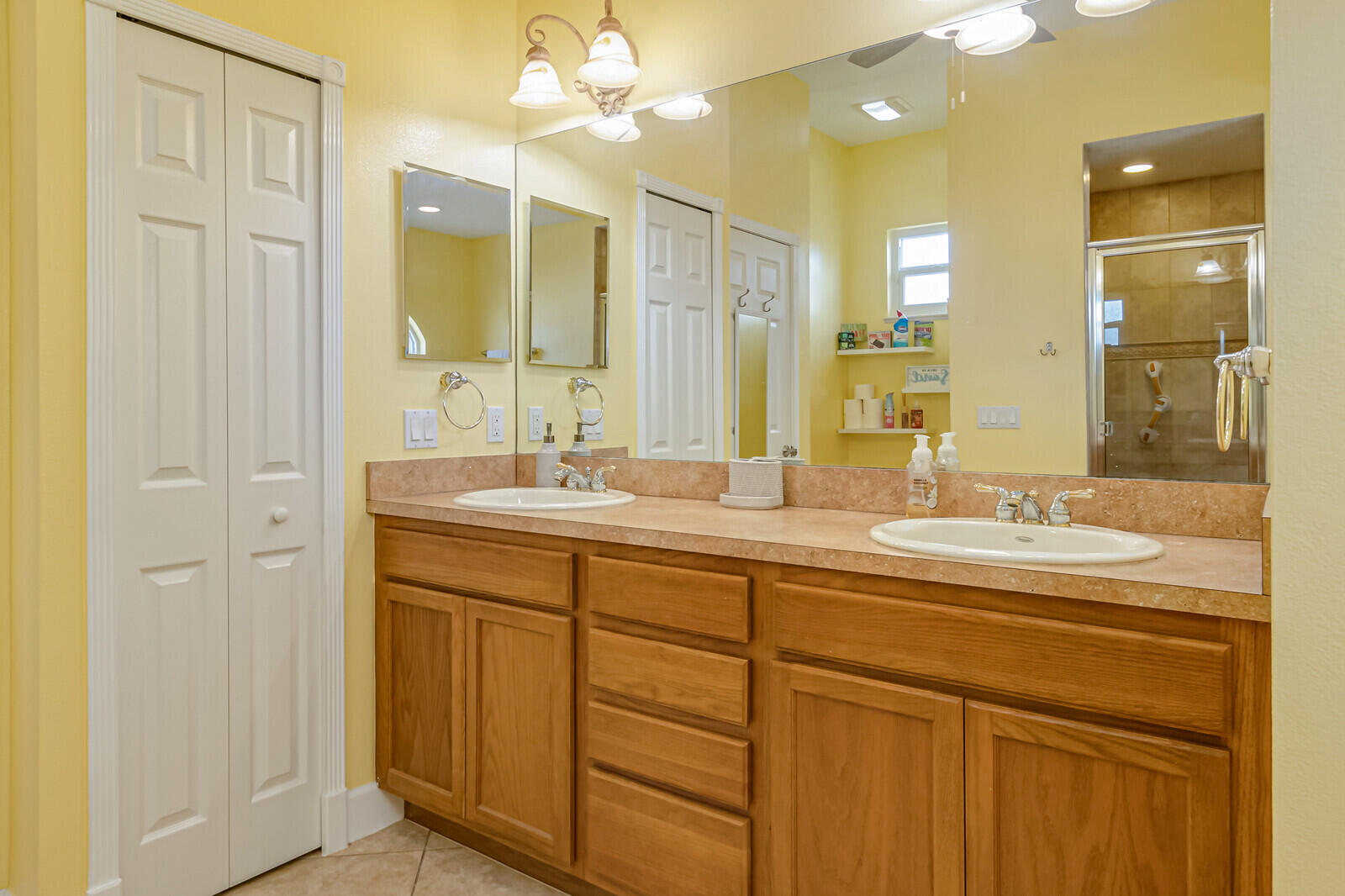 4320 S Highway Grant, FL 32949 - Photo 24 of 76 a bathroom with double vanity sinks and a mirror